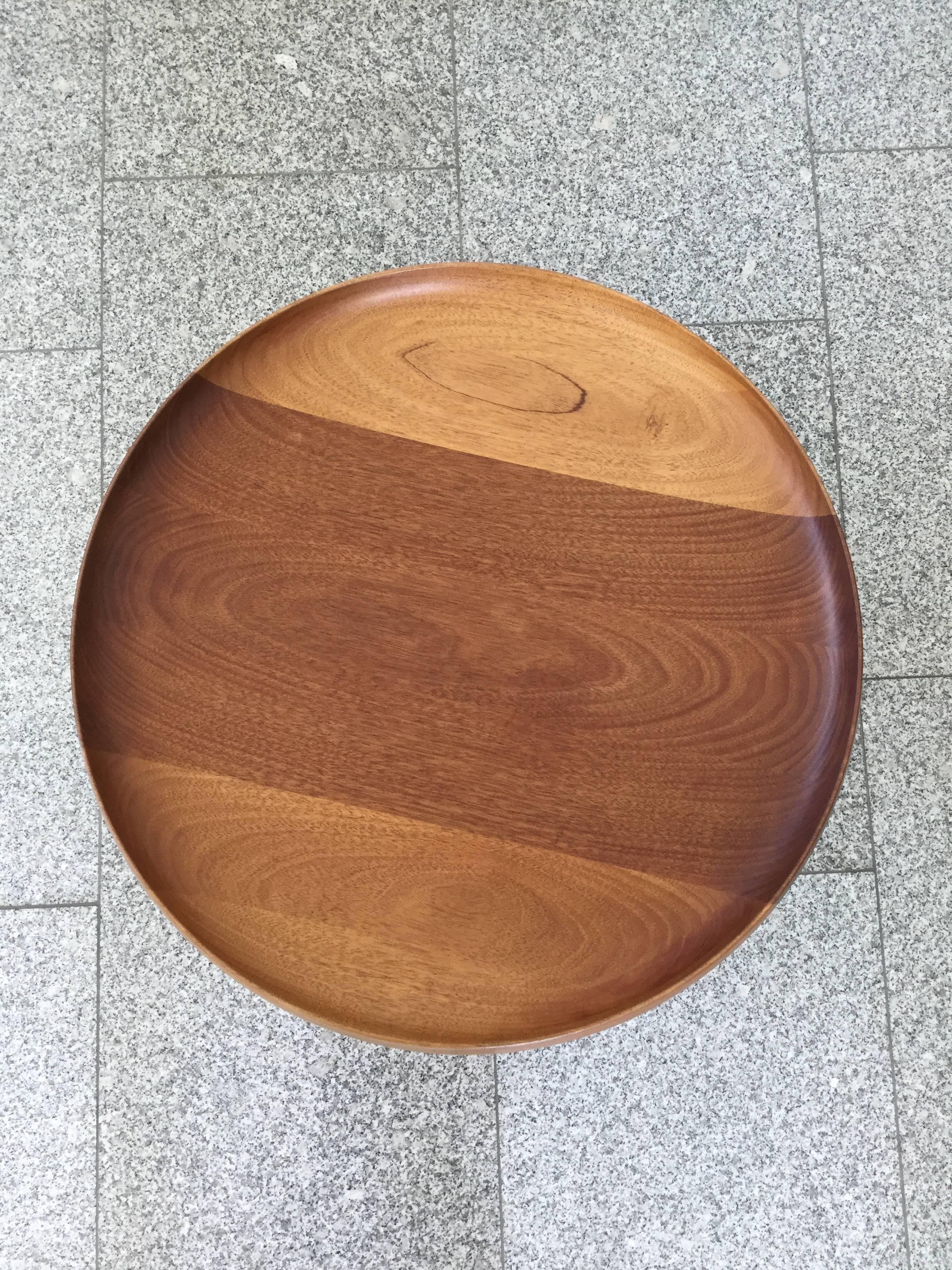 Beautiful solid mahogany (rarely seen) wooden lathe turned tray / fruit bowl on three legged brushed steel frame. Executed by PP Mobler Denmark in 2010 (as marked). 

The fruit bowl was designed by Hans Wegner in 1956 and is a result of a rare