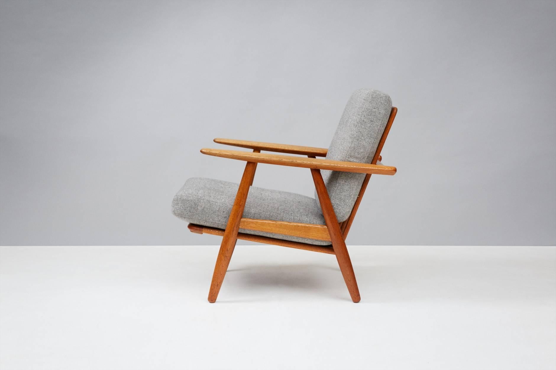 Hans J. Wegner

GE-240 Cigar chairs, 1955

Produced by Getama, Gedsted, Denmark. Oak frames with original sprung cushions reupholstered in grey Kvadrat Hallingdal wool fabric with contrasting buttons.