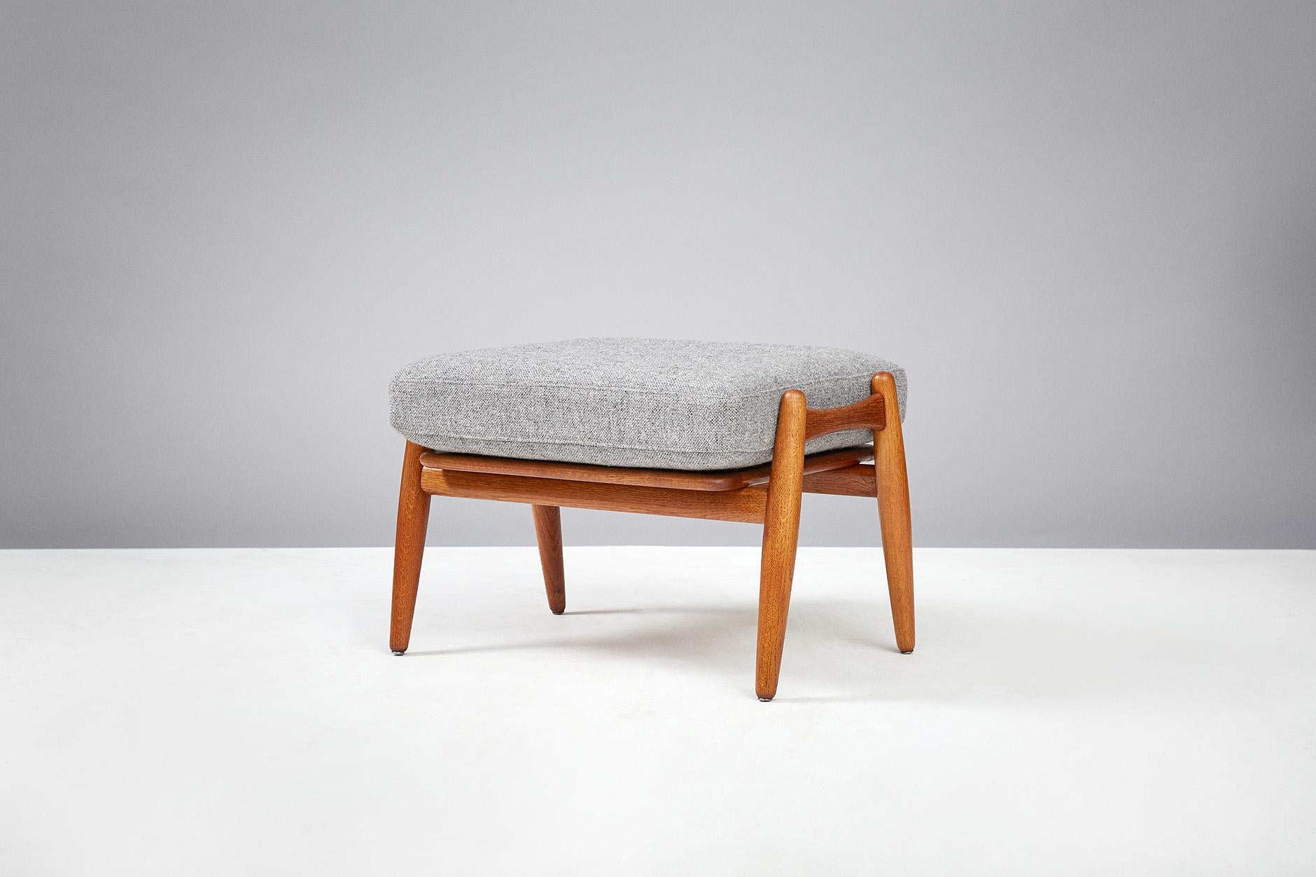 Hans J. Wegner
GE-240 cigar stool, circa 1950s.

Oak ottoman produced by Getama, Denmark to compliment the GE-240 and GE-260 lounge chairs. Original sprung cushion has been recovered in grey Kvadrat wool fabric.