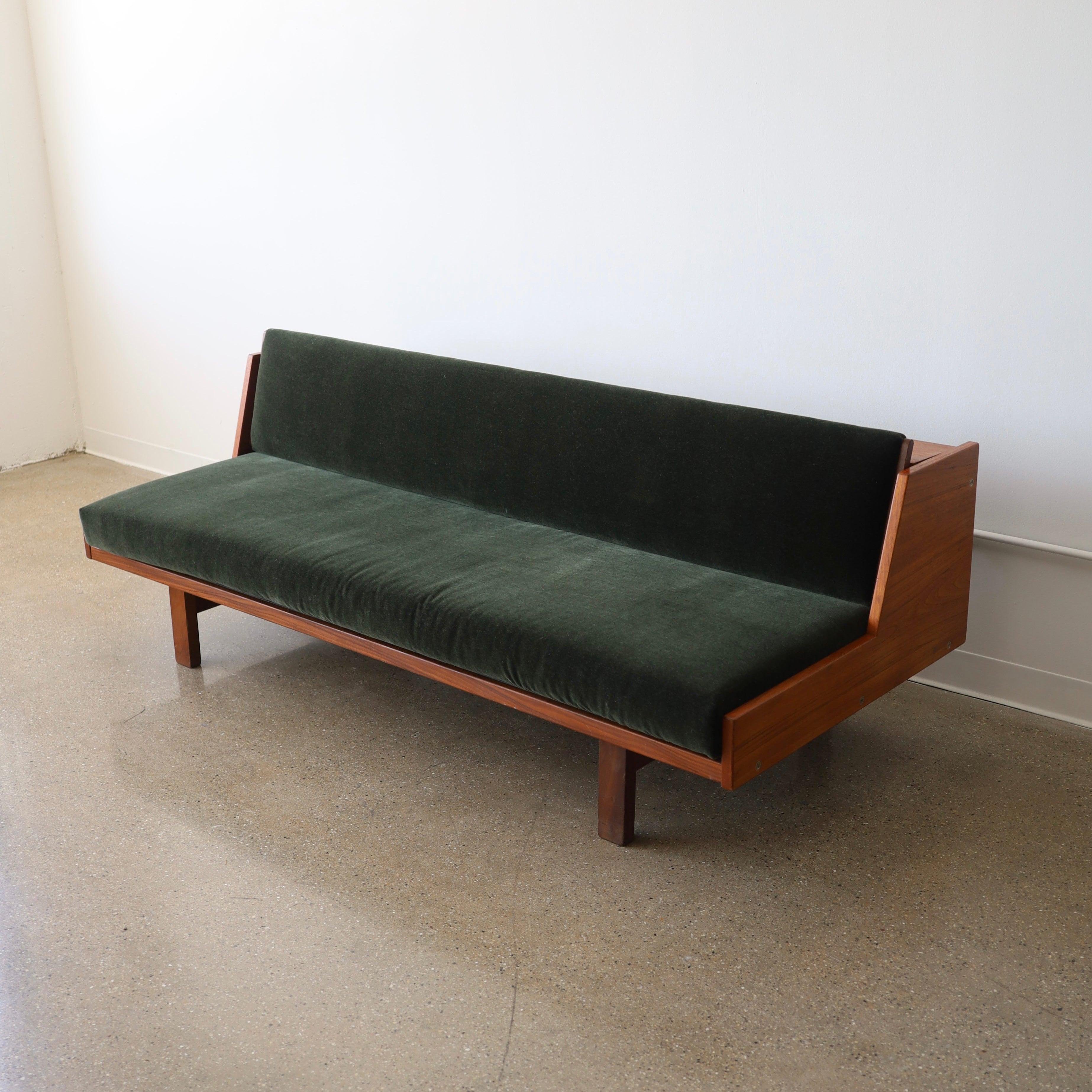 c. 1960s, produced by Getama in Denmark. This piece has been fully restored with new cushions and emerald mohair. There are some minor scuffs present and a couple chips on the legs but it is in otherwise excellent condition