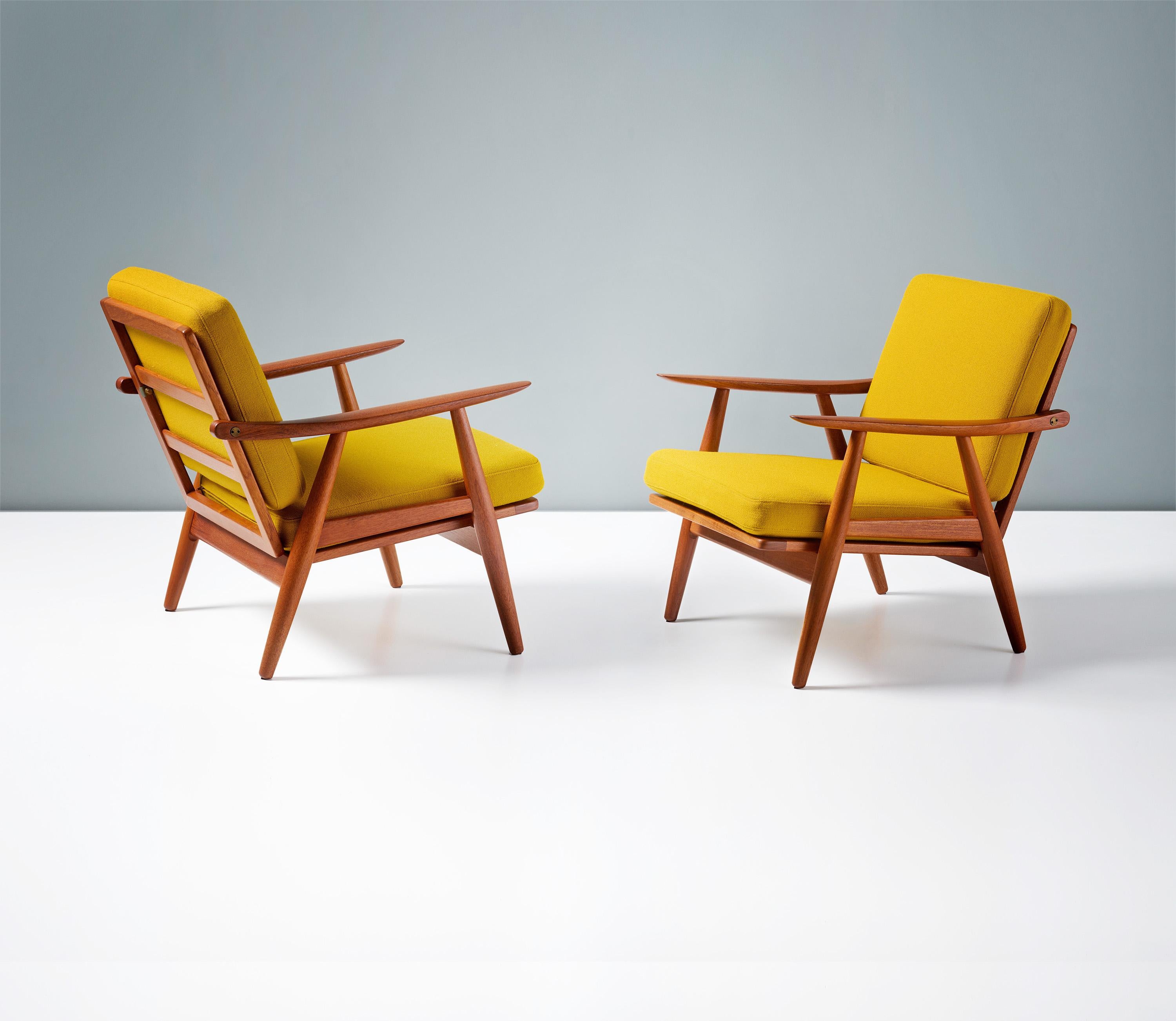 Hans Wegner

Hans Wegner - Model GE-270 Lounge Chairs, 1956

A pair of classic Hans Wegner lounge chairs produced by iconic producers: Getama in Gedsted, Denmark in the 1950s. Restored teak frames with custom-designed exposed brass fittings. The new