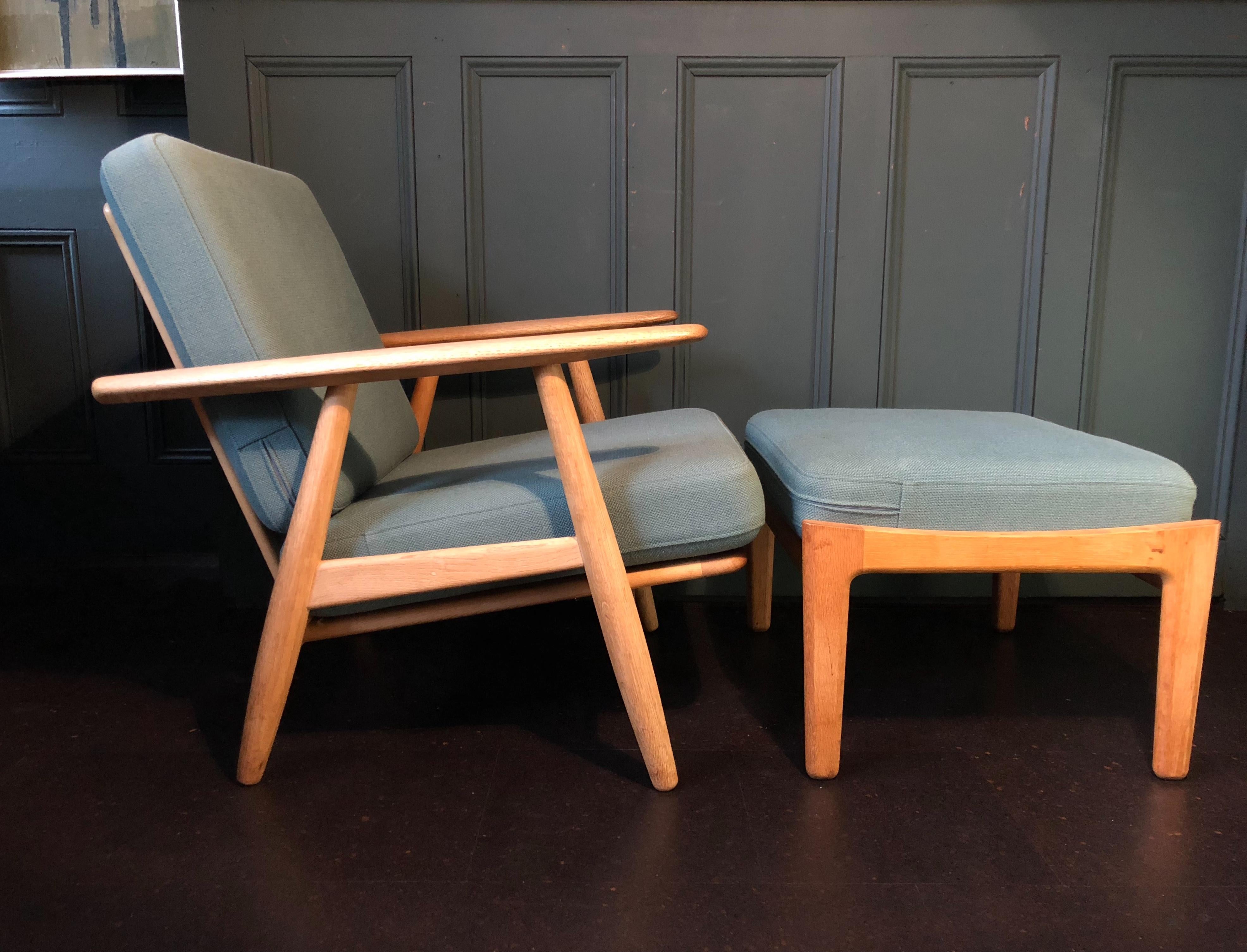 Hans Wegner ge240 cigar chairs with ottomans. Pair available. These are original 1950s models from GETAMA with makers and designers marks still intact. Constructed from European white oak. These are in magnificent condition, have been thoroughly