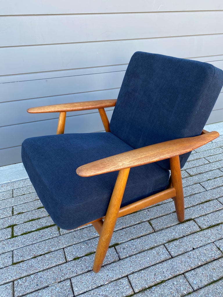 Hans Wegner for Getama GE-240 lounge chair, sometimes called the Cigar series because of the shape of the arm. Teak arms with oak body. Soewhat beefier than the GE-270 series. Beautiful Size and Scale. Chair was reupholstered about 13 years ago,