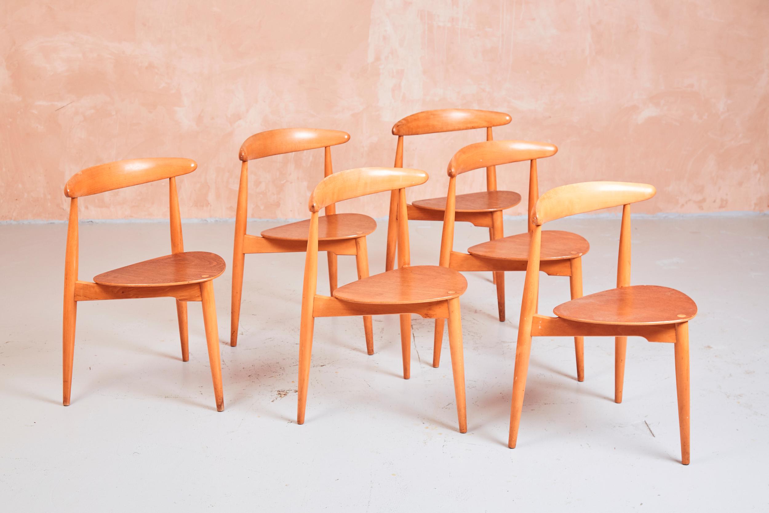 Originally designed by Hans Wegner in the 1950s, the FH4103 was manufactured by Fritz Hansen and sold in London by Story’s of Kensington.

Constructed from beech and teak wood, the FH4103 chairs are also known as the ‘heart’ chairs, due to their