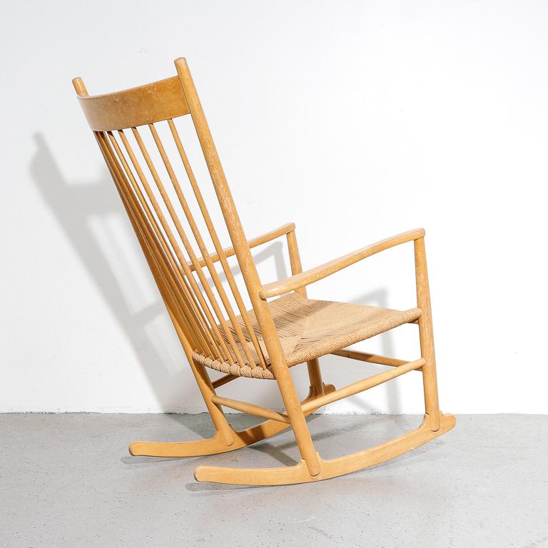 Vintage 'J16' model rocking chair by Hans Wegner for Fredericia, 1950s. Shaker inspired design with tall spindle backrest and woven papercord seat.