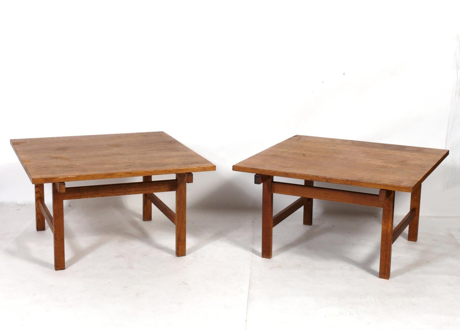 Pair of large scale Danish Modern oak end tables, designed by Hans Wegner for Andreus Tuck, Denmark, circa 1950s. These tables are currently being refinished and will look great when completed. They are a versatile size and can be used as end or