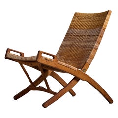 Hans Wegner, Lounge Chair, Oak, Rattan, Brass, Denmark, 1950s