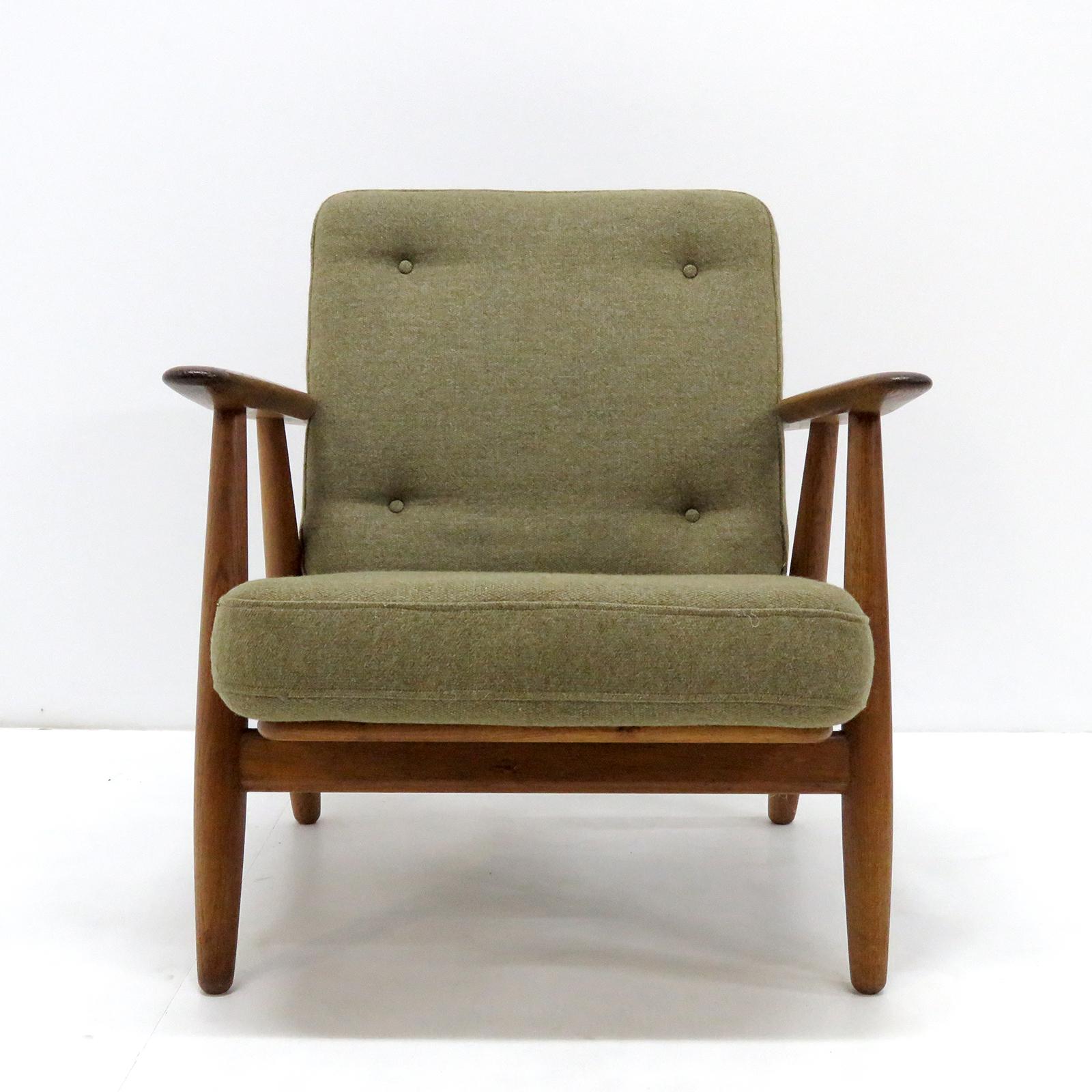 Large-scale Model GE-240 armchairs 'Cigar', designed by Hans Wegner for GETAMA in 1955 with solid oak frames and original cushions in greenish wool, marked. Priced individually.