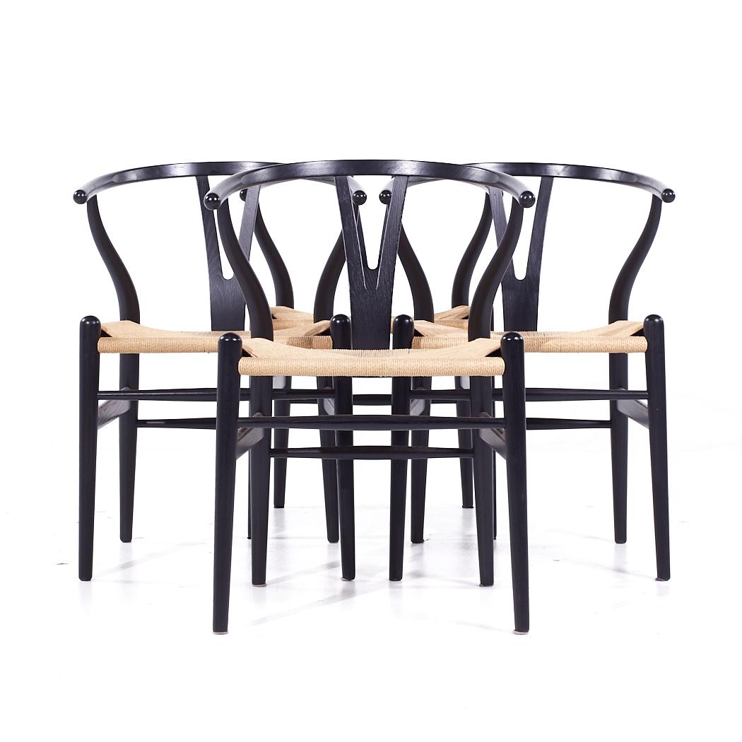 Hans Wegner Mid Century Wishbone Chairs - Set of 4

Each chair measures: 21.5 wide x 20 deep x 30 inches high, with a seat height of 17.5 and arm height/chair clearance of 28 inches

All pieces of furniture can be had in what we call restored