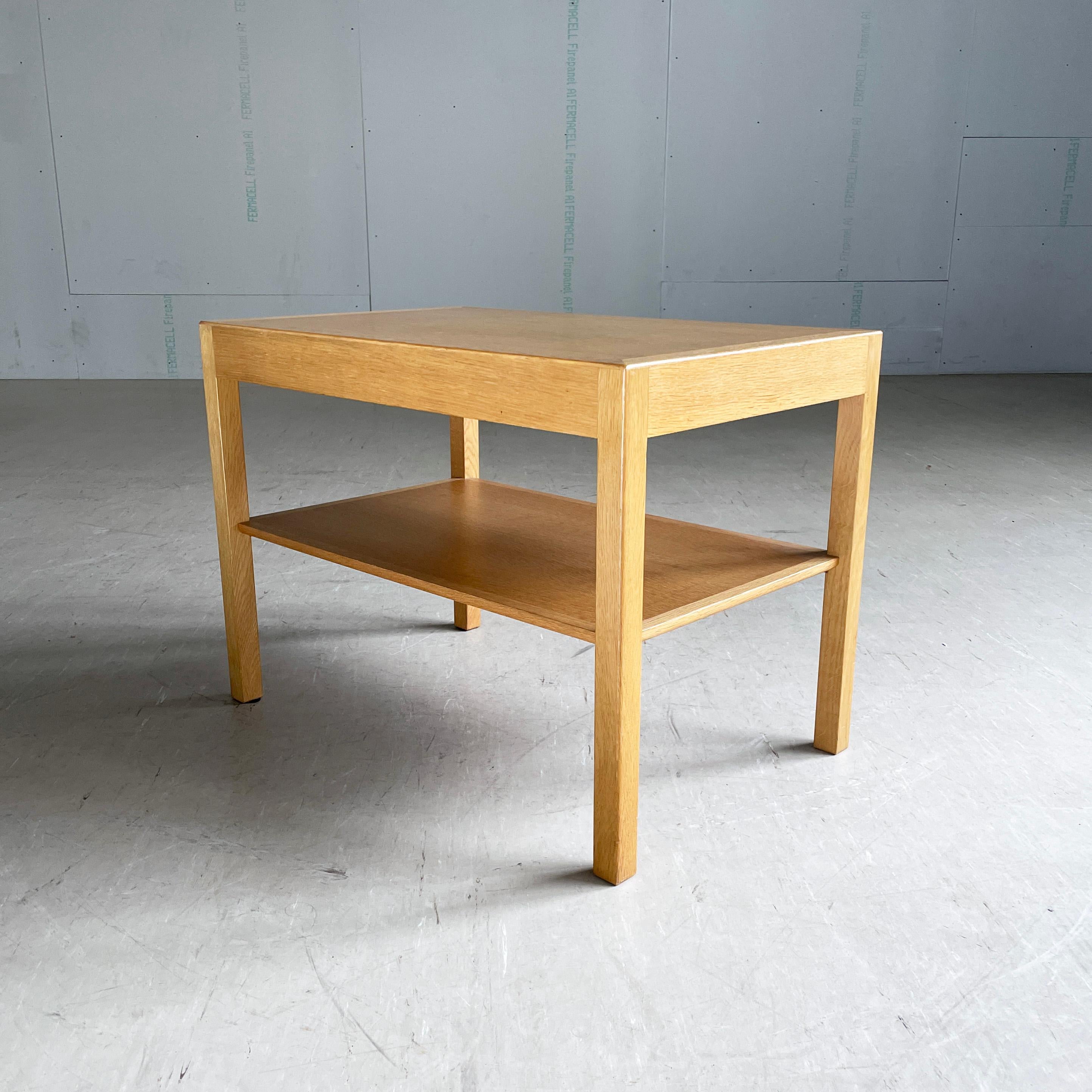 Mid Century Danish oak side table designed by Hans J. Wegner. Produced by Andreas Tuck, Denmark. Beautifully made oak tabletop with lower magazine shelf
Designer: Hans J. Wegner
Producer: Andreas Tuck, Denmark (with Production Stamp)
Measurements: