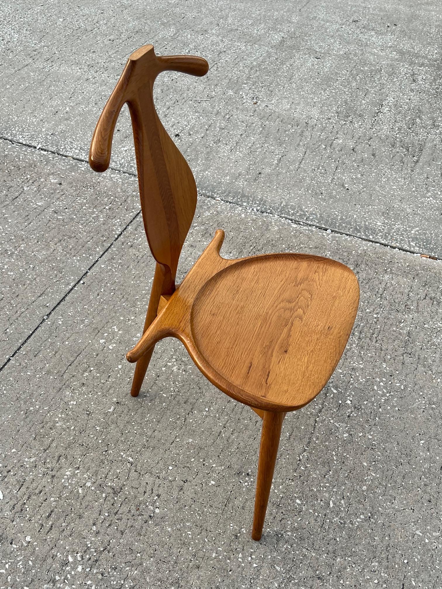 A rare and highly sculptural original Hans Wegner valet chair. Manufactured by Johannes Hansen, Copenhagen, Denmark and imported and sold by Knoll. This version made entirely of solid oak in very good condition. Signed under the seat.