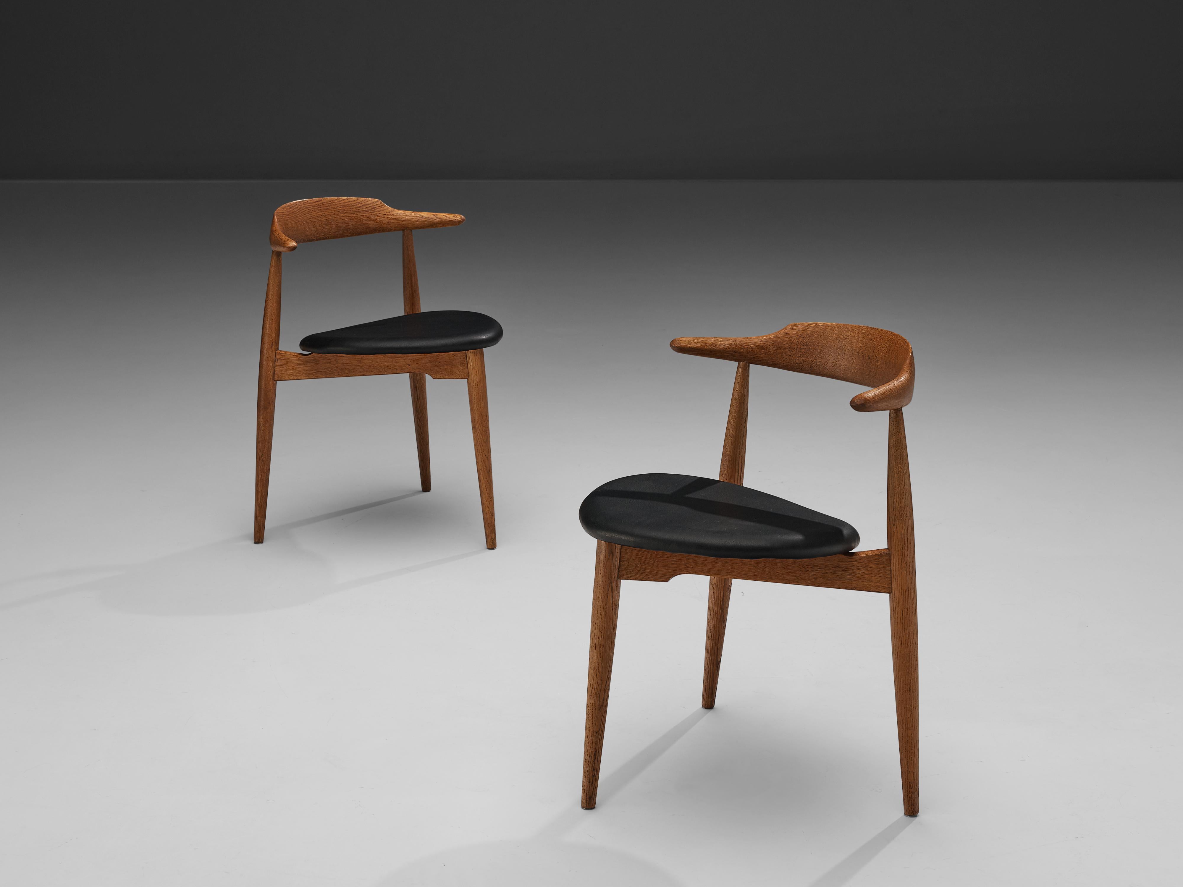 Hans Wegner for Fritz Hansen, ‘Heart’ dining chairs model ‘4103’, oak, leather, Denmark, designed in 1953

This pair of dining chairs are designed to take up as little space as possible whilst at the same time having a simplistic, natural and