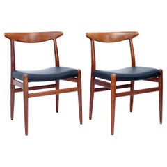 Hans Wegner, pair of Teak and leather dining chairs, model W2 for C.M. Madsen, 1