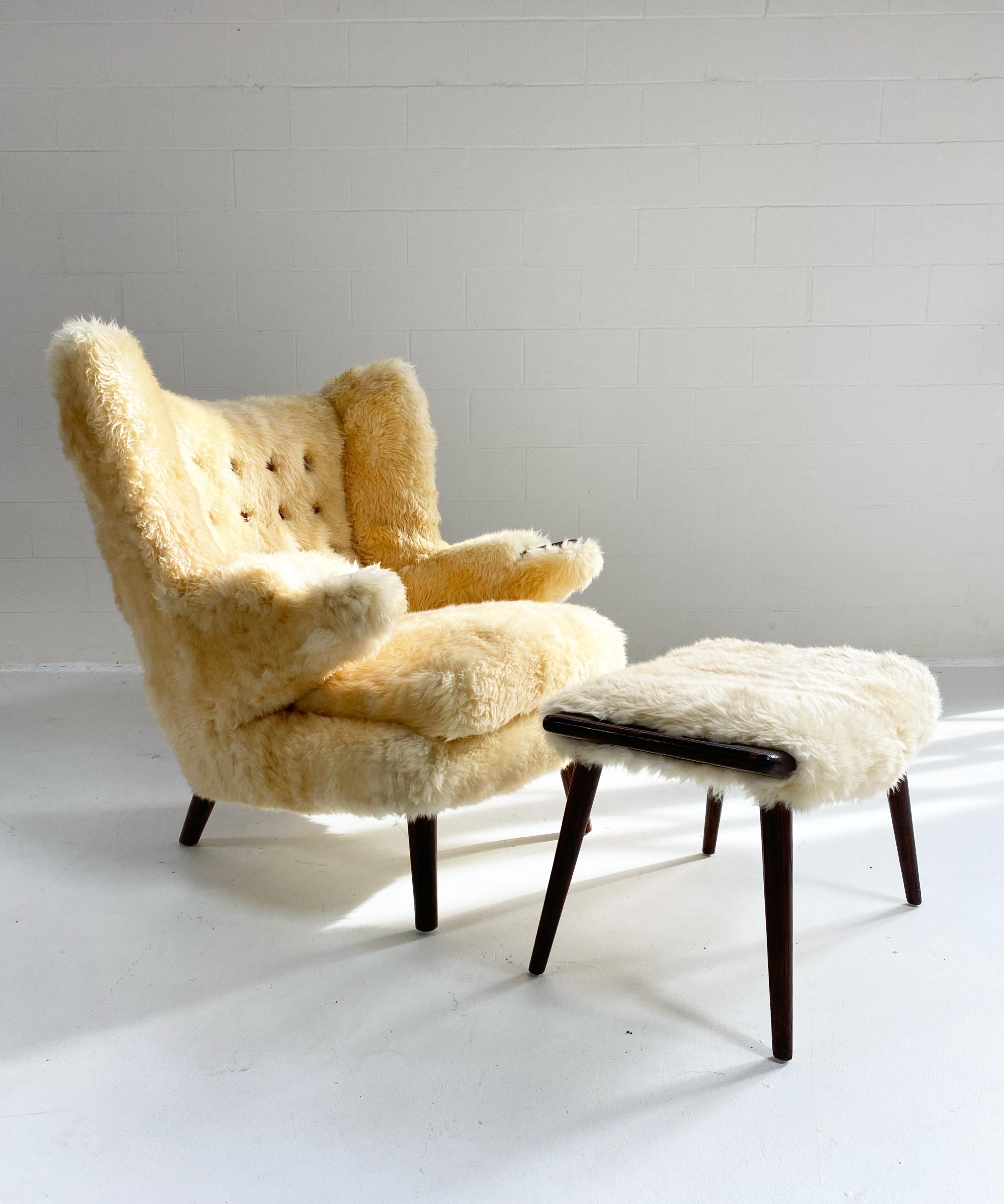 A vintage papa bear fully restored for the ultimate in coziness. The low pile Texas sheepskin is like the inside of an Ugg boot and the underside of a western saddle. The stained oak is in beautiful condition. Leather buttons on the back finish off