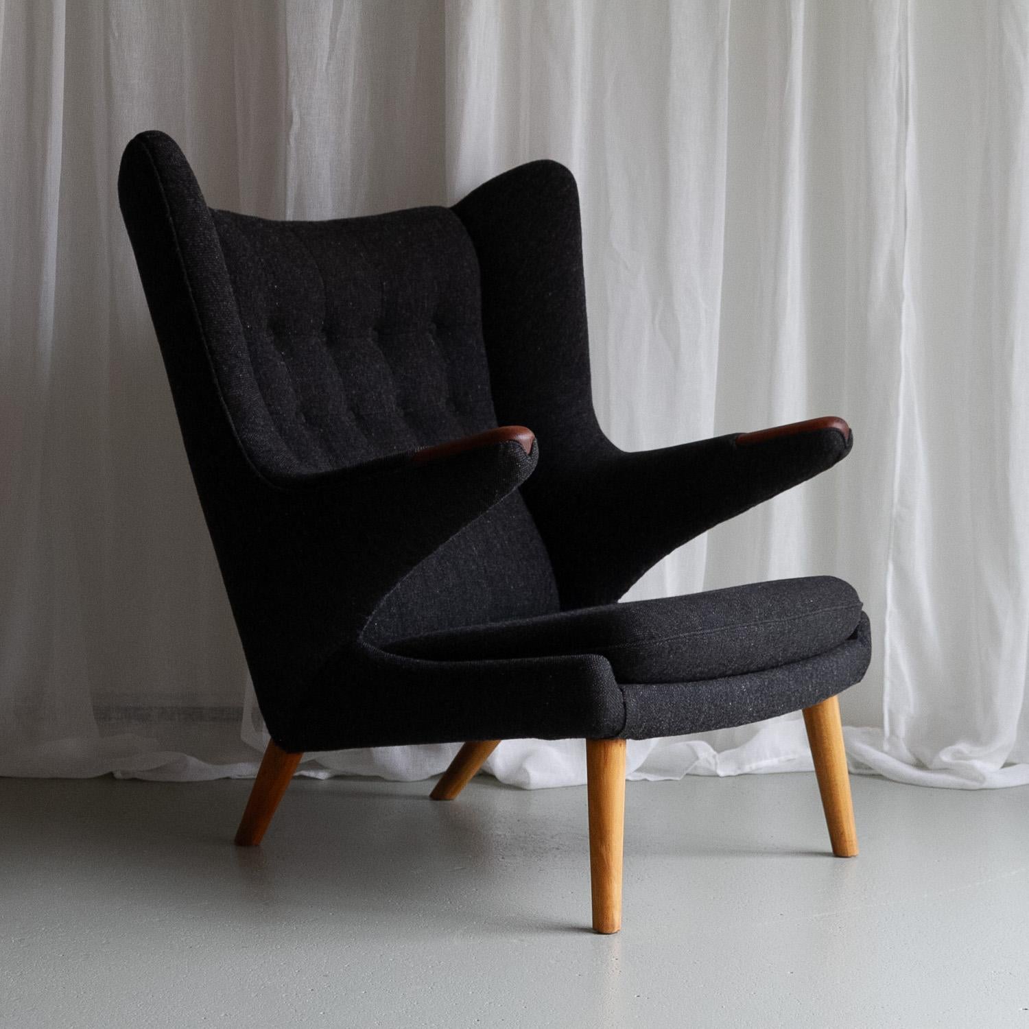 Hans Wegner Papa Bear Chair by AP Stolen, 1960s.

Fairly early Papa Bear armchair AP-19 with beech frame and legs and teak claws designed by Hans J. Wegner in 1951 for A.P. Stolen Denmark. Also known as the Teddy Bear chair.
This is an early model