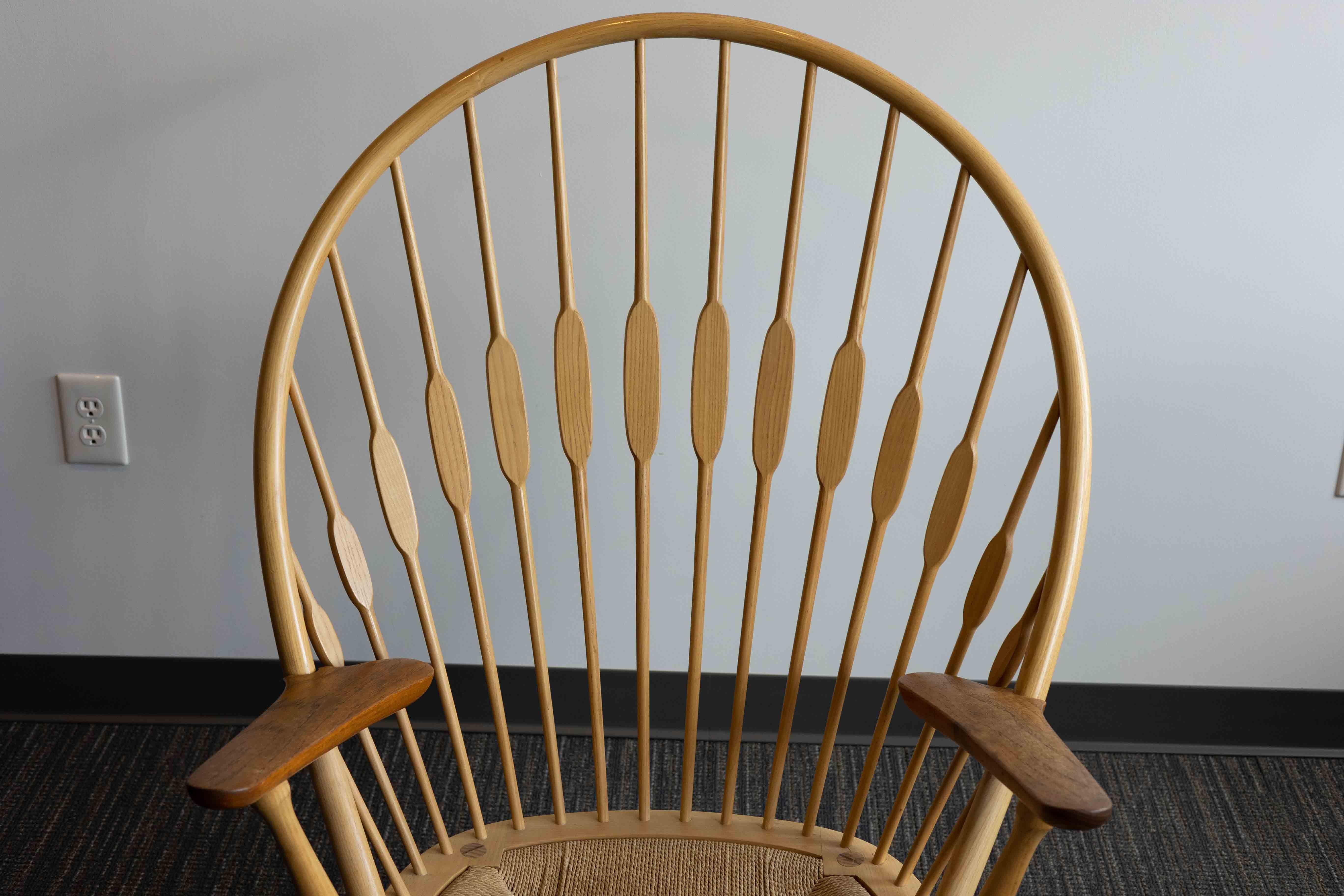 A mid-century modern PP550 ‘Peacock’ chair designed by Hans Wegner in 1947 for Johannes Hansen.

Modeled after a traditional American Windsor chair, Hans Wegner’s Peacock chair strips the form to reveal its construction while retaining aesthetic,