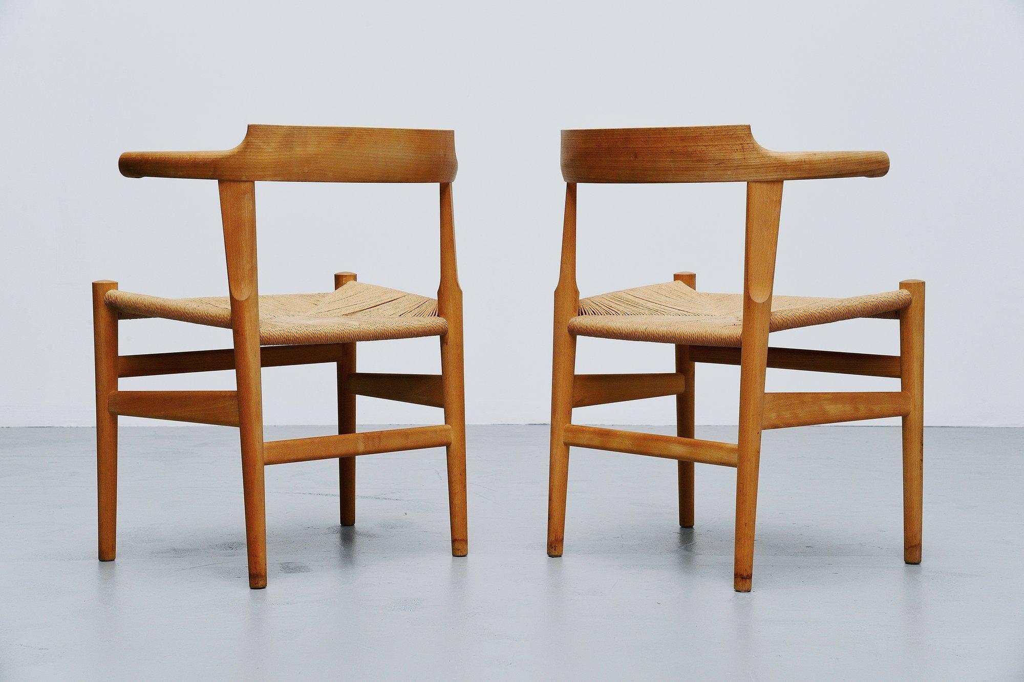 Pair of elbow chairs model PP68 designed by Hans J. Wegner for PP Møbler, Denmark, 1987. The chairs are made of solid oak wood and have a papercord seat. The chairs are in original condition, have some wear from age and usage at the legs. Very rare