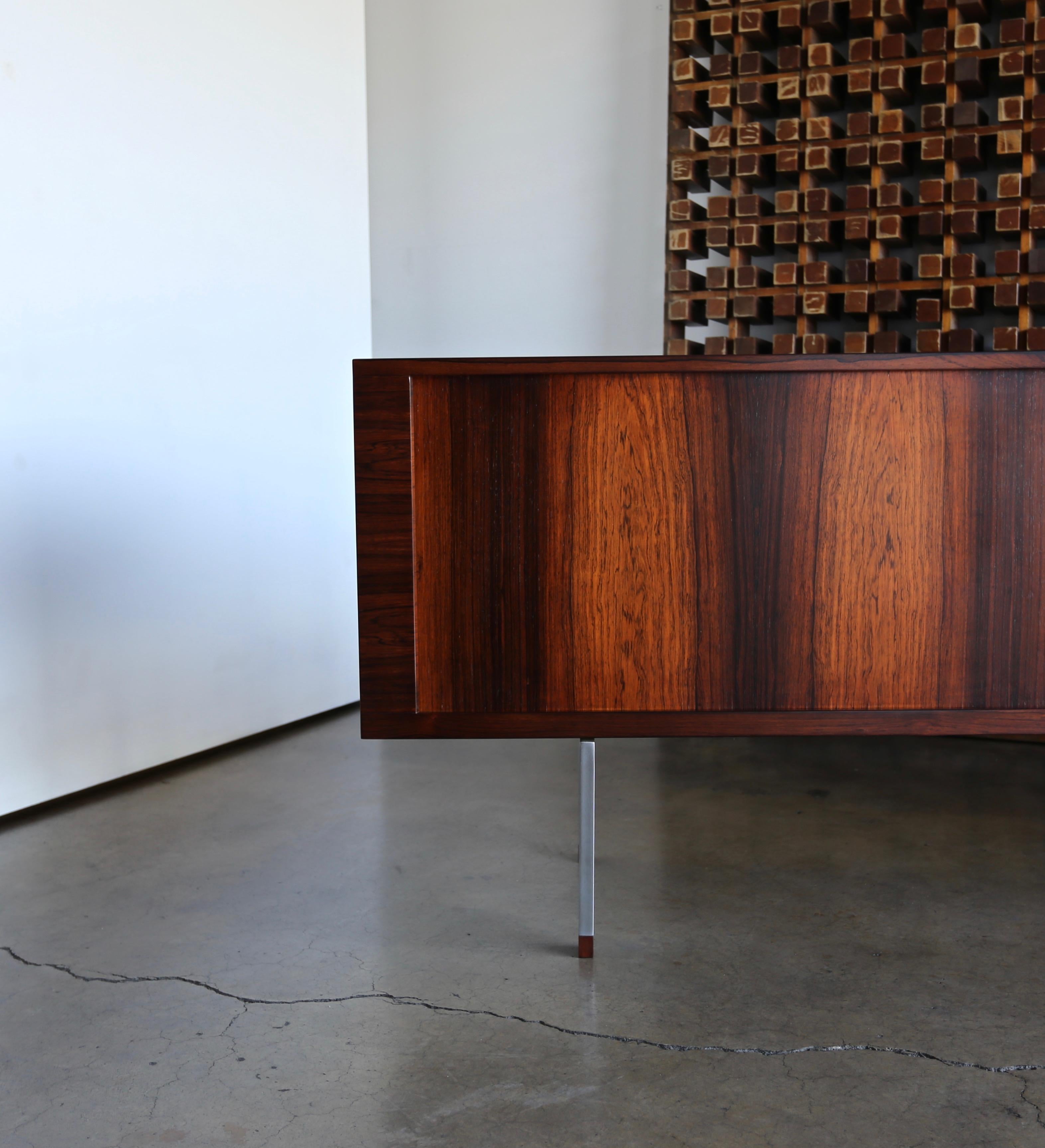 Hans Wegner rosewood “President”Credenza for Ry Møbler. Denmark, circa 1965. The rosewood has been expertly restored. With tambour doors and dynamic rosewood grain throughout.