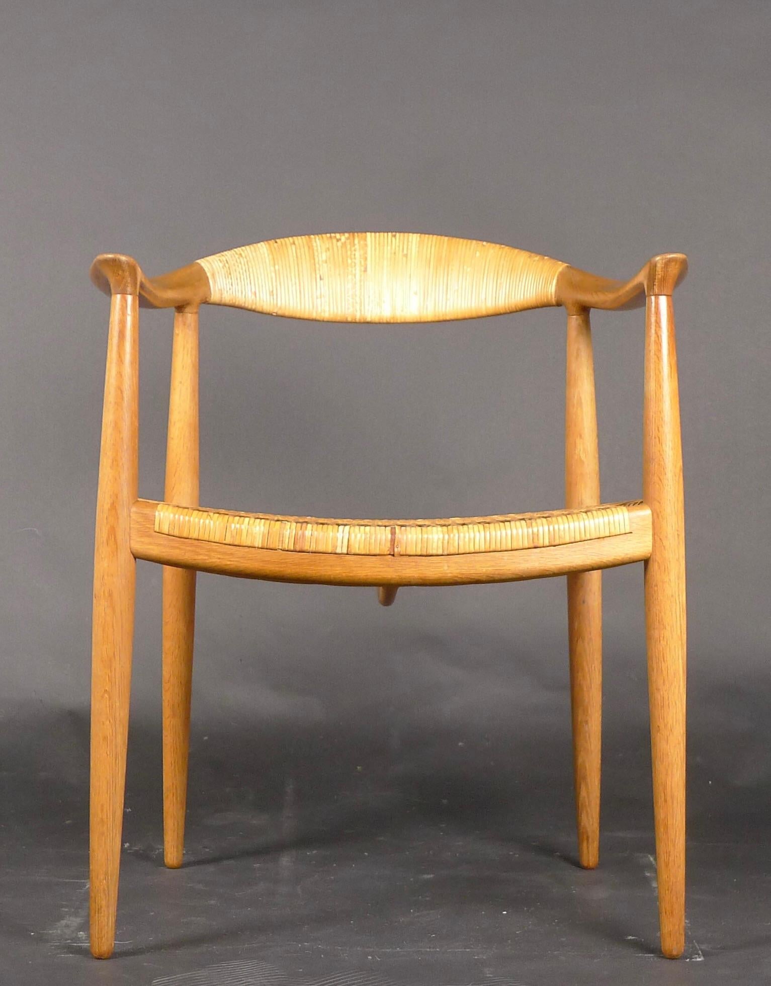 Known as The Round Chair, or simply The Chair, Hans J Wegner created the design for Johannes Hansen to display at the annual exhibition of the Copenhagen Cabinetmakers' Guild in 1949.  The early examples had a mortise and tenon joint connecting the