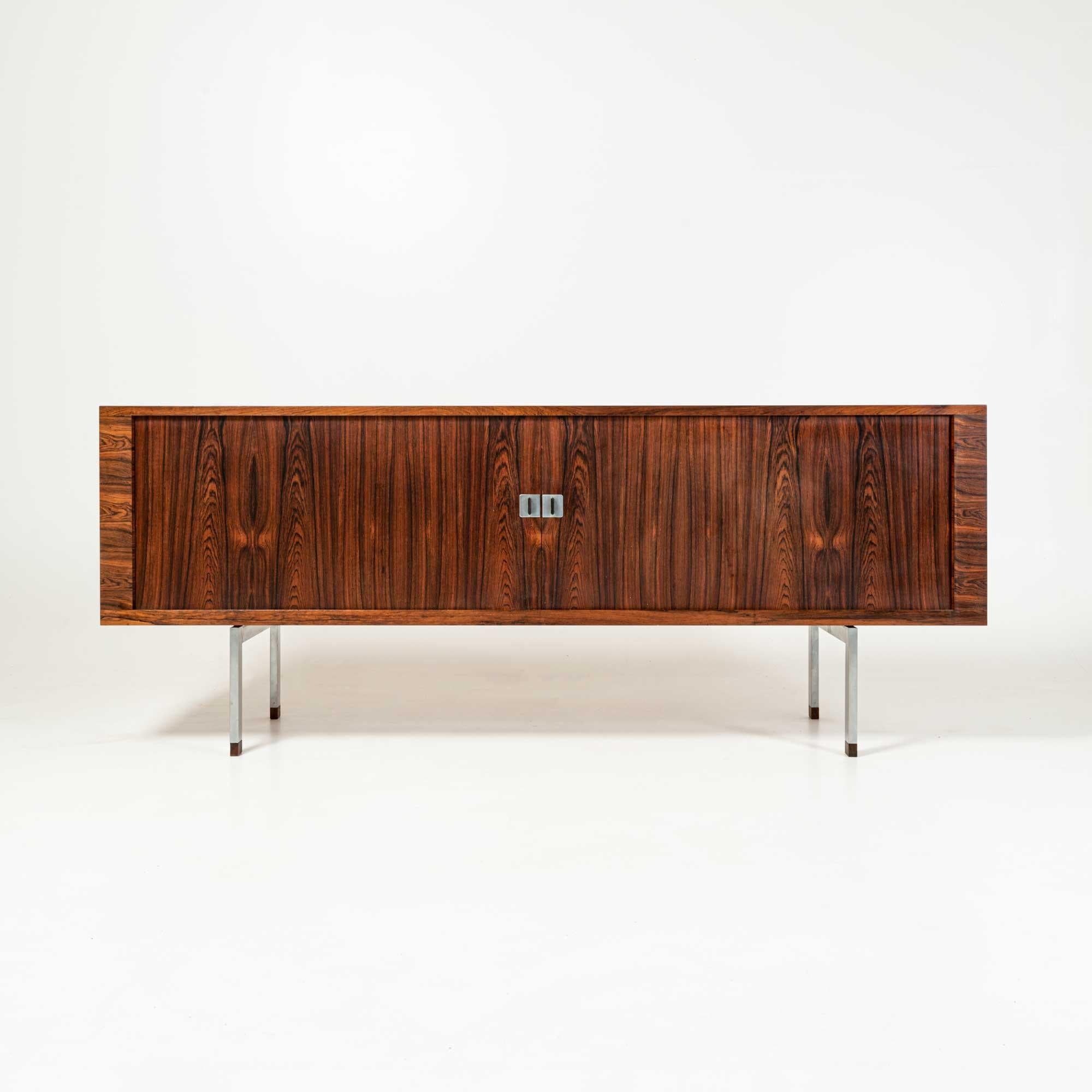 Produced in 1959, this Hans J. Wegner 'President' Tambour door credenza Model Ry-25 came in teak and rosewood. The 