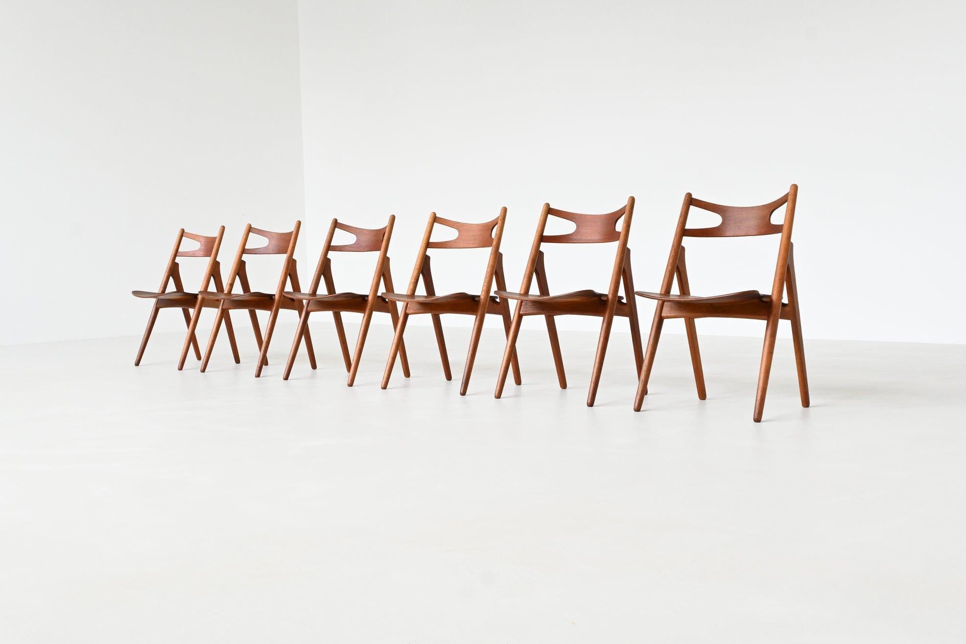 Outstanding set of six CH29 dining chairs, also known as the iconic “Sawbuck” chairs, designed by Hans J. Wegner in 1952 and produced by Carl Hansen & Søn. Named after the traditional sawhorse used by Scandinavian carpenters and lumberjacks, the