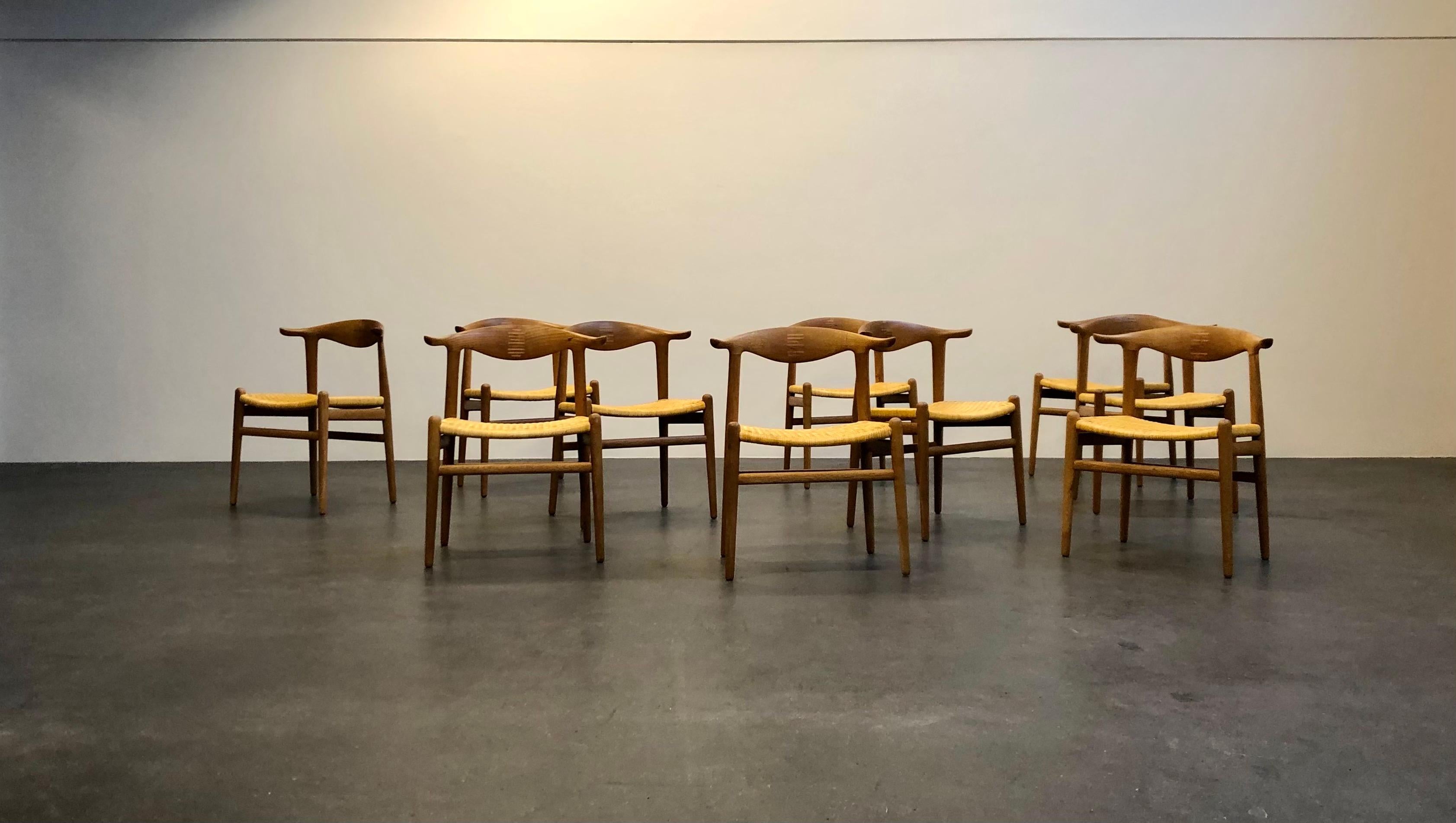 Hans Wegner set of 10 'Cow Horn' chairs in oak and cane for Johannes Hansen.

This chair was designed in 1952 and exhibited at the same year at the 'Copenhagen Cabinetmakers’ Guild' exhibition.