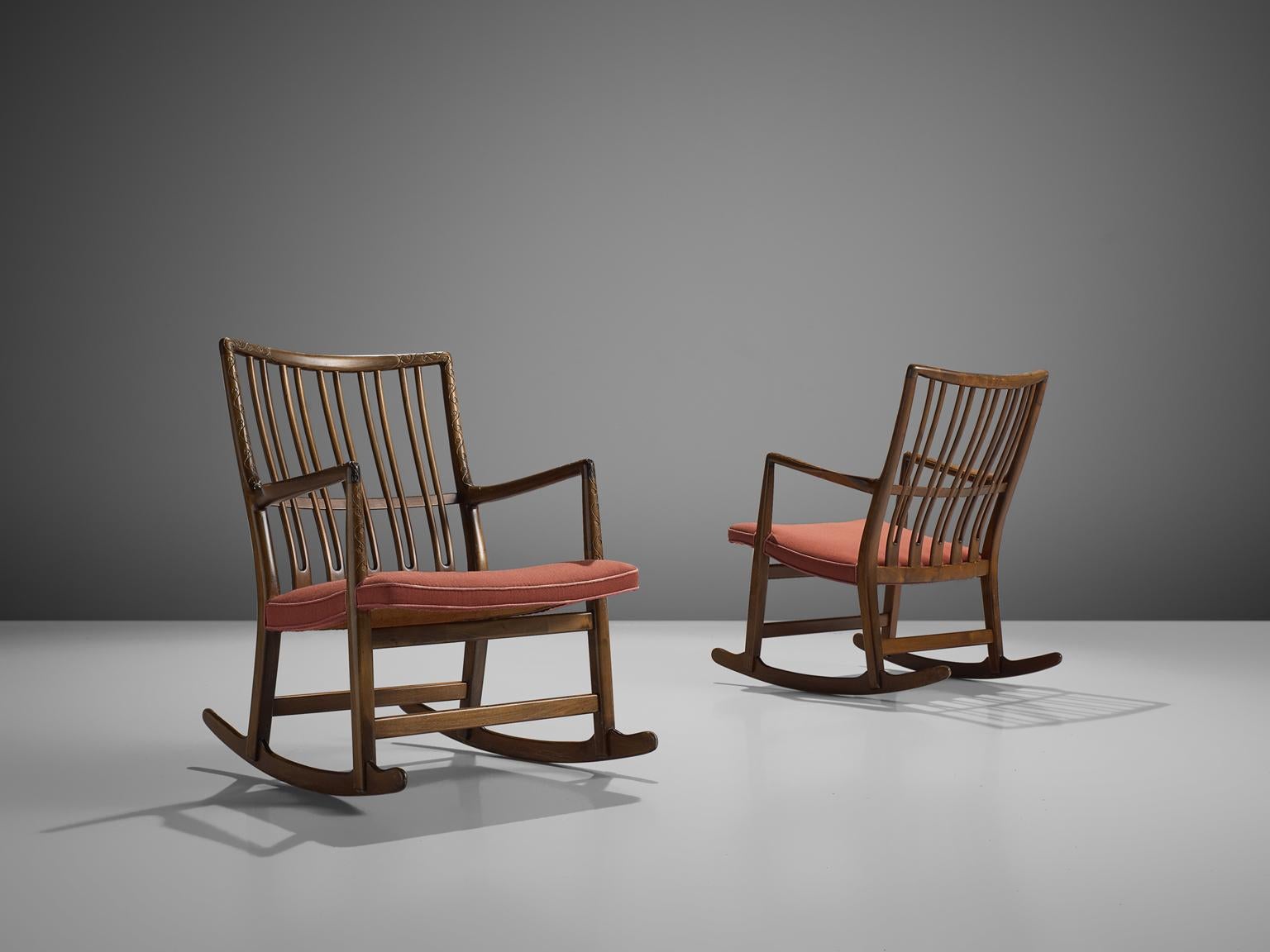 Hans Wegner for Mikael Laursen, set of two beech rocking chairs model ML-33, Denmark, 1940s.

These rocking chairs are an early design of Hans Wegner, produced by master-carver and cabinetmaker Mikael Laursen. Model ML-33 is known as the first