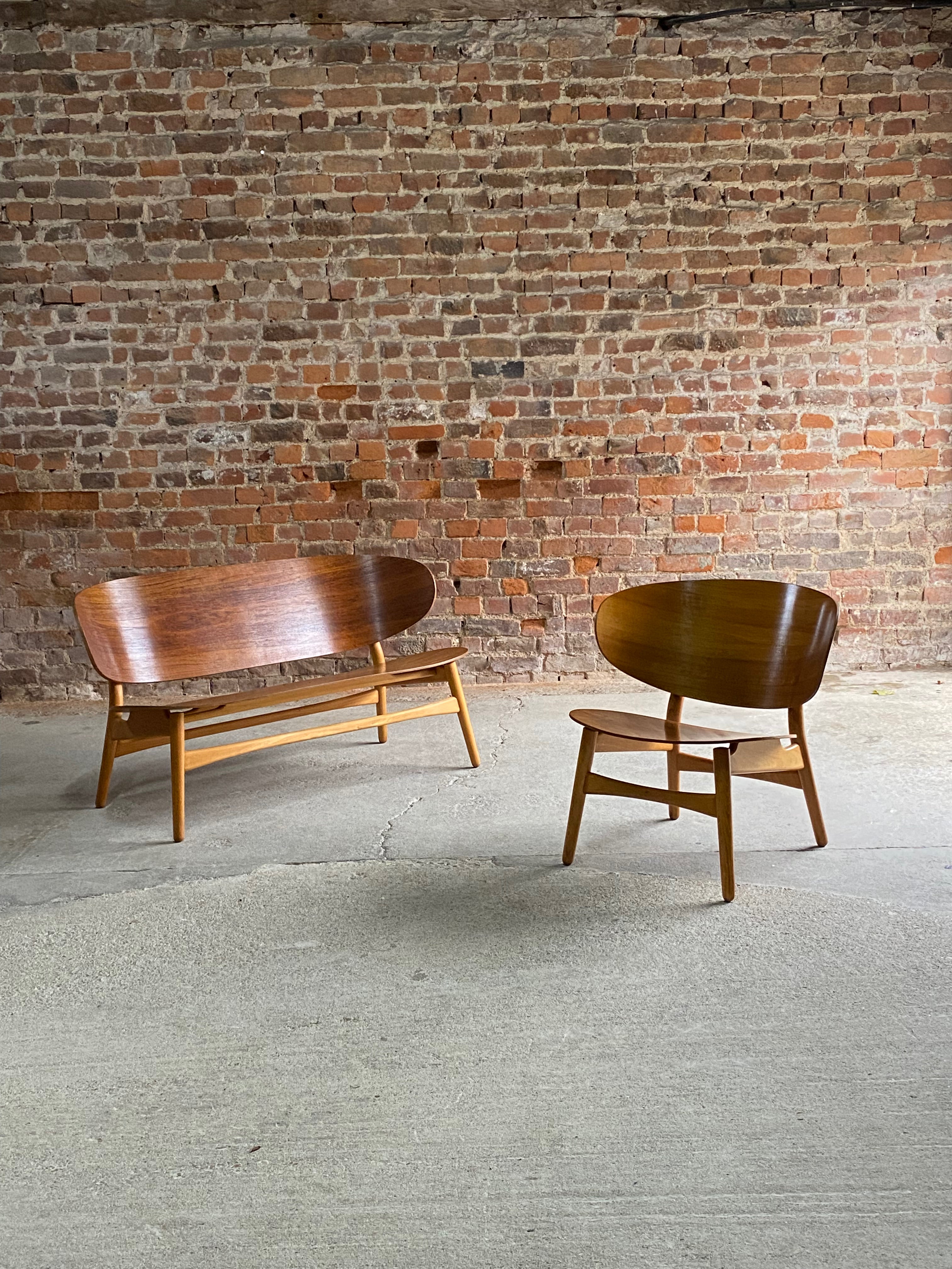 Hans  Wegner Shell Settee Model 1935 & Shell Chair Model 1936 by Fritz Hansen 1950

Hans J Wegner Shell Settee Model 1935 by Fritz Hansen Denmark circa 1950, this extremely rare and coveted collectors piece features a laminated teak shell back and