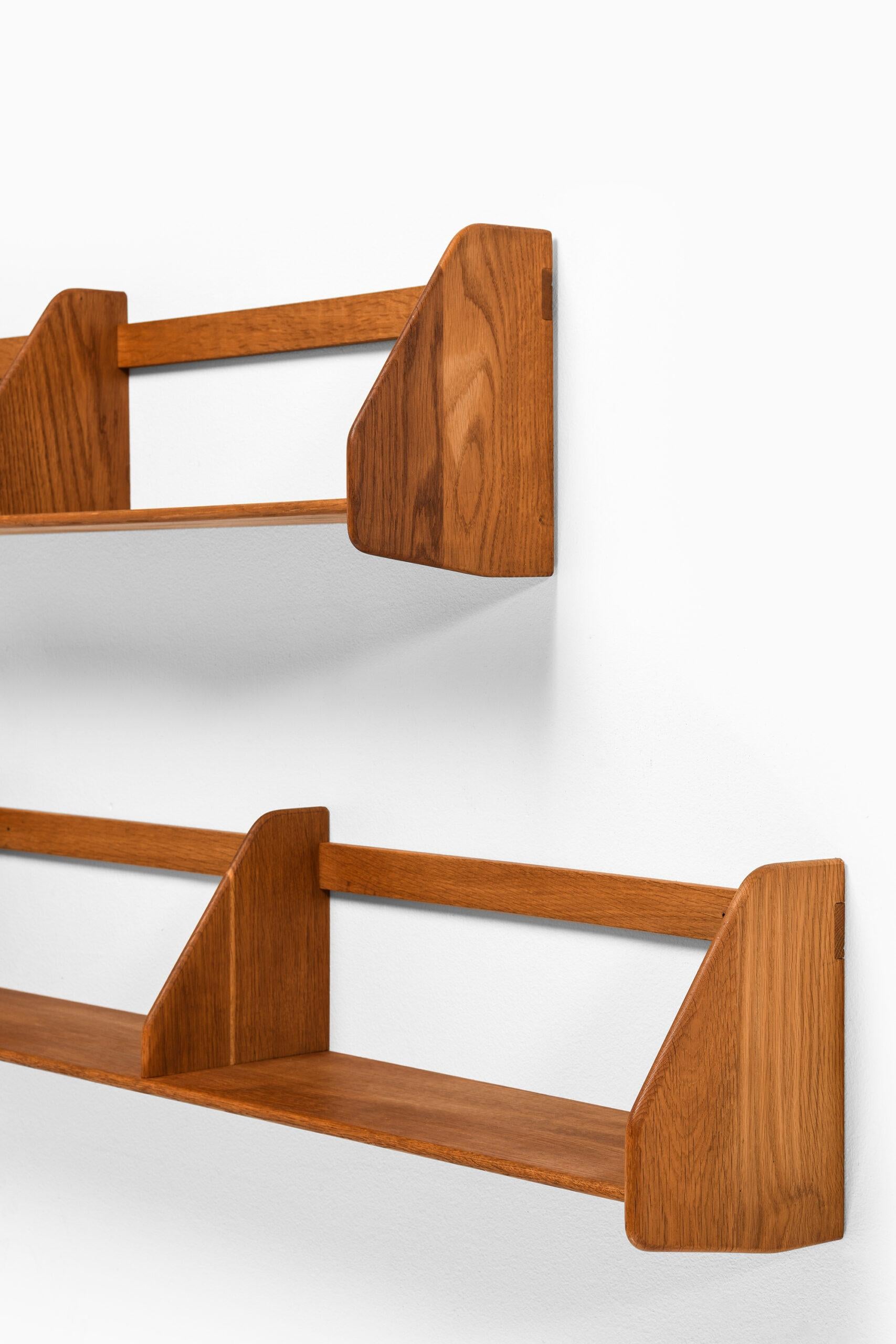 Wall mounted shelves designed by Hans Wegner. Produced by Ry Møbler in Denmark.