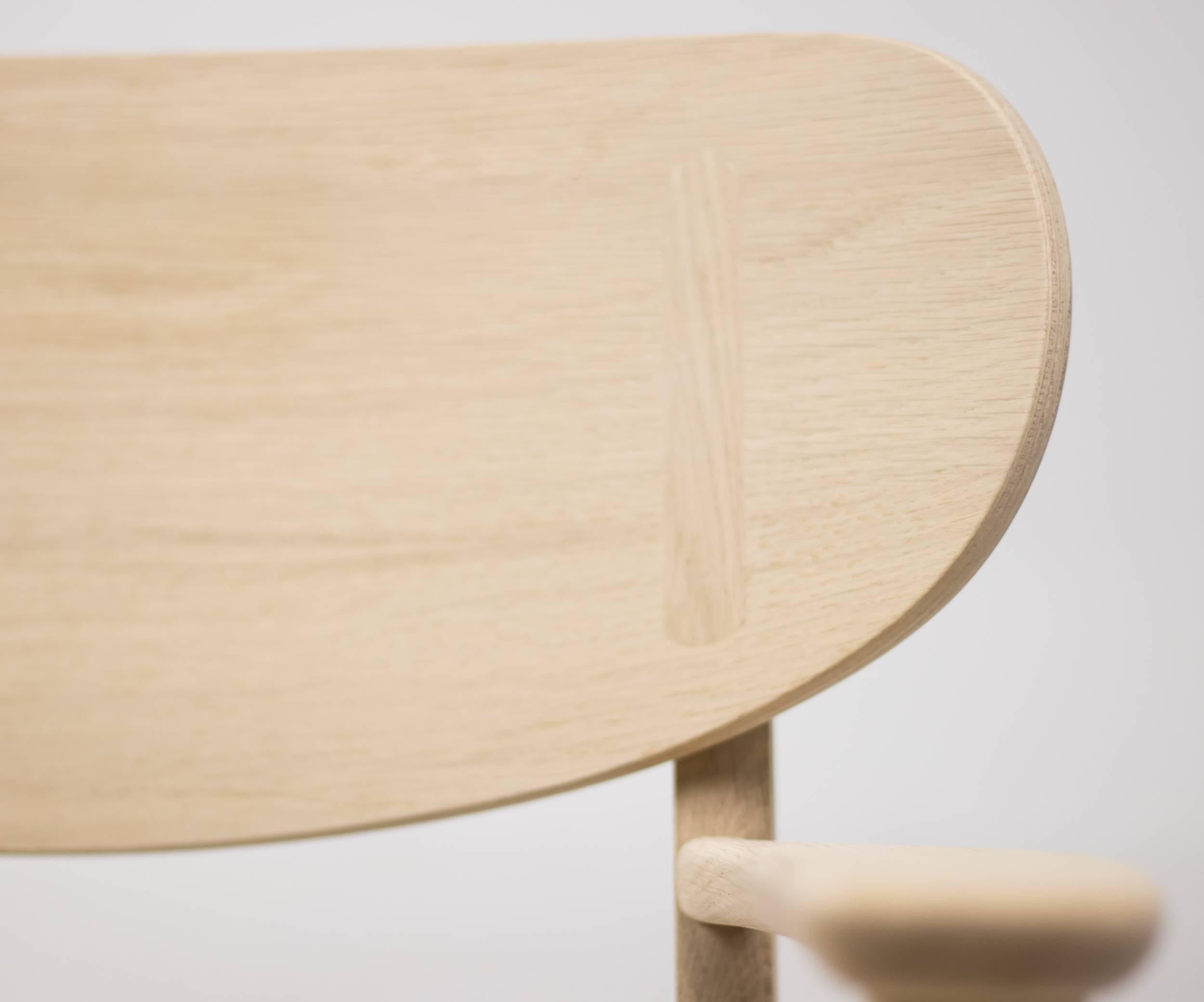 A special limited edition, engraved with the official reissue date and Hans J. Wegner’s signature, of the CH22 lounge chair soap-treated oak. The chair has a complex structure with a solid wood frame and a distinctively moulded, organically shaped
