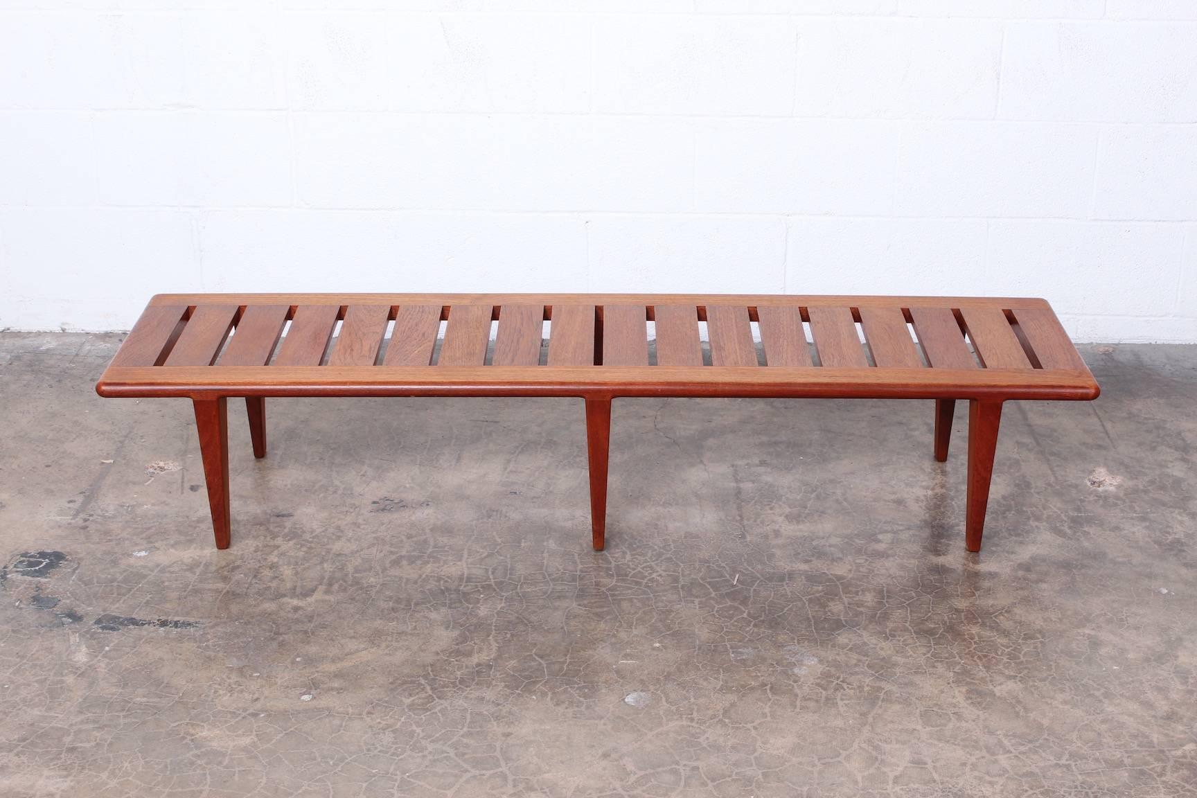 Solid teak bench designed by Hans Wegner for Johannes Hansen.
