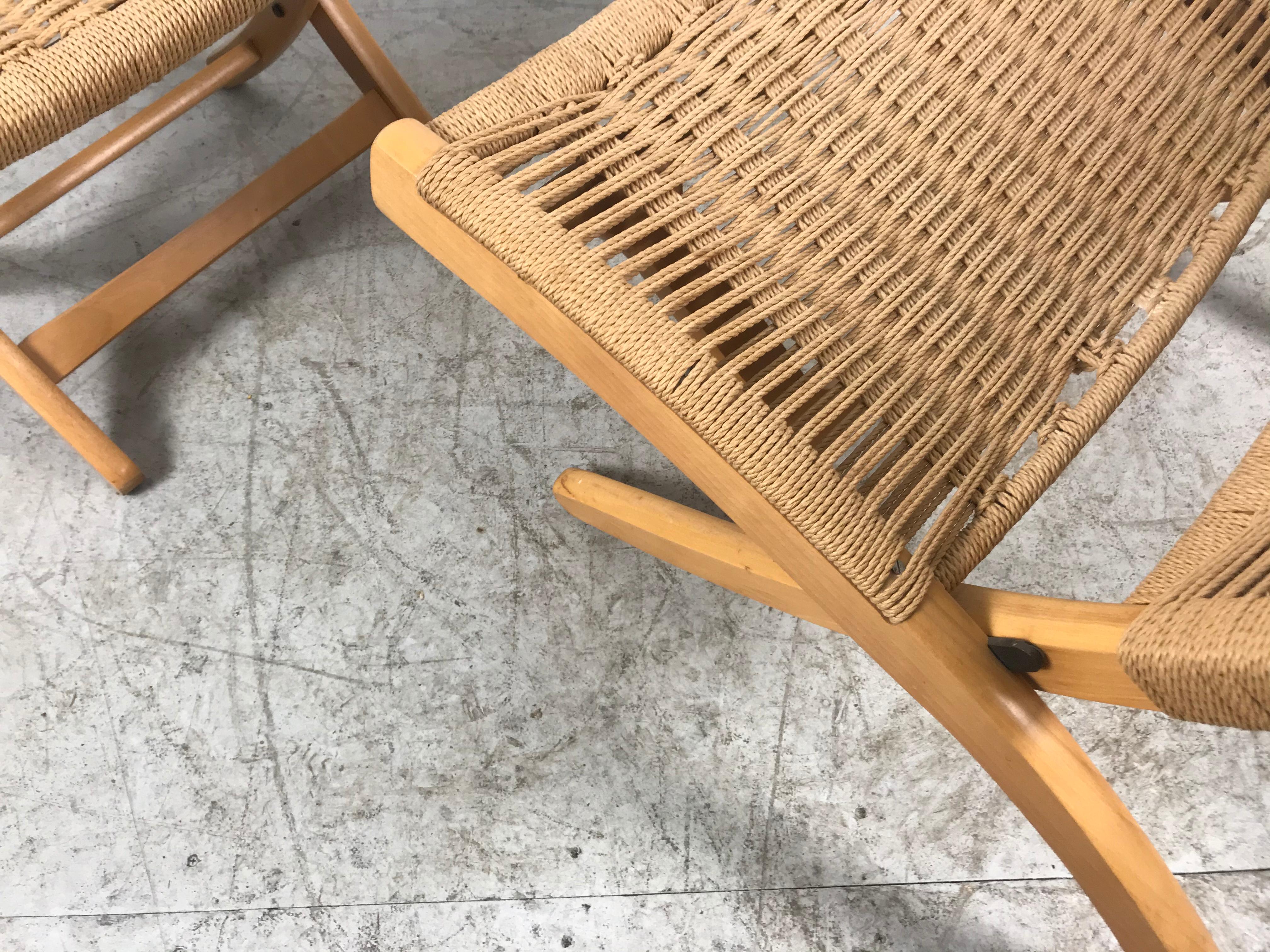 Midcentury woven teak and rope folding chair and ottoman. Both chair and ottoman are folding. Rope and frame are in excellent condition. Extremely comfortable. Superior quality and construction.