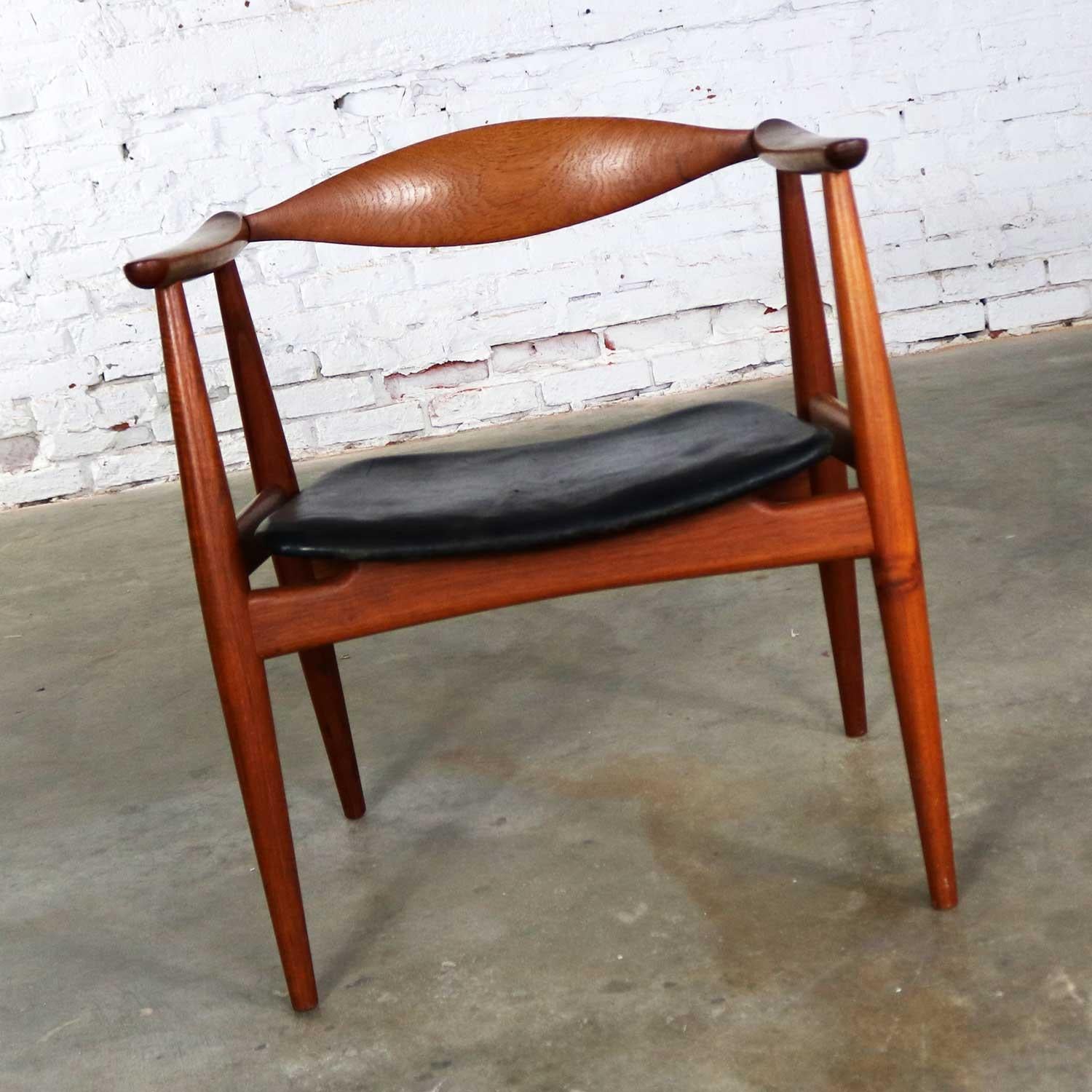 Handsome and iconic Scandinavian Modern CH 35 armchair designed by Hans Wegner for Carl Hansen and Son, Denmark. Their mark is present on the underside of the chair. This gorgeous chair is in wonderful vintage condition overall. Its beautiful teak