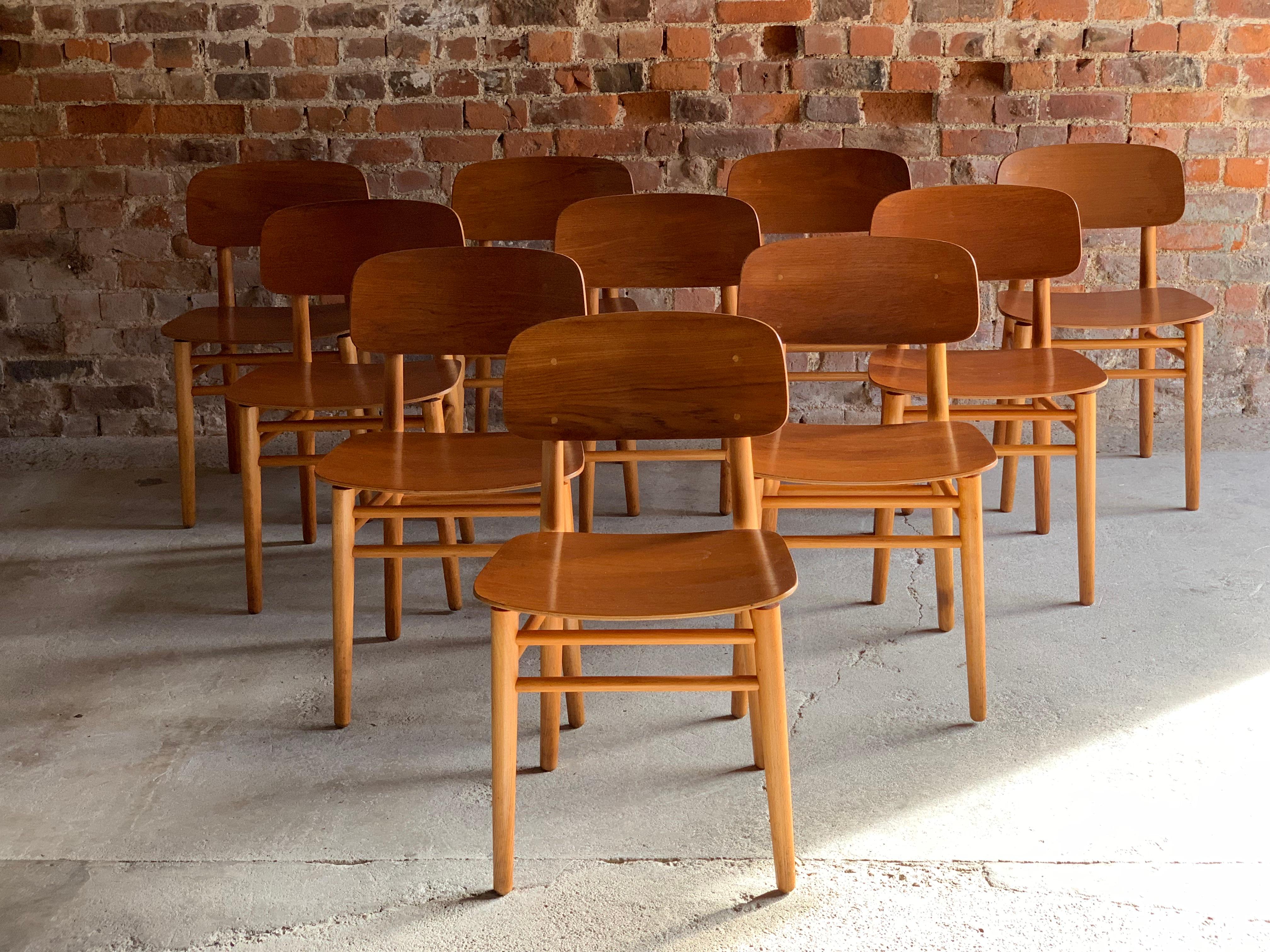 A magnificent and extremely rare set of ten Hans Wegner model 4101 teak and beech dining chairs for Fritz Hansen, Denmark, circa 1950, the chairs with bent plywood teak backrests and seats float above a solid beech frame with makers stamp to