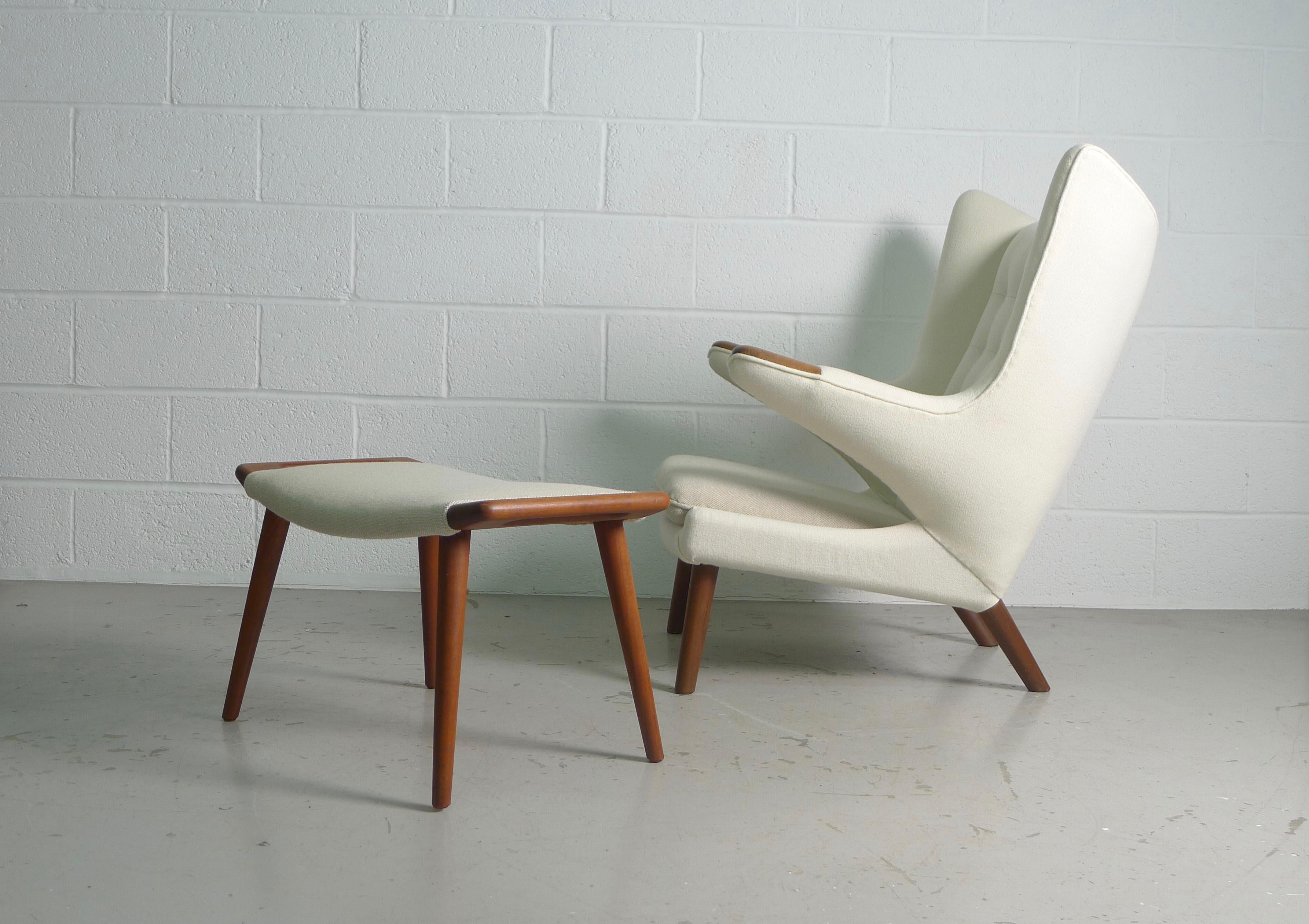 Hans Wegner for AP Stolen, Denmark, 1951. A model AP 19 Papa Bear and ottoman . An iconic chair beautifully reupholstered with white Kvadrat wool , contrasting seat cushion and ottoman . Chair has teak paws and legs , ottoman all teak . 
Both