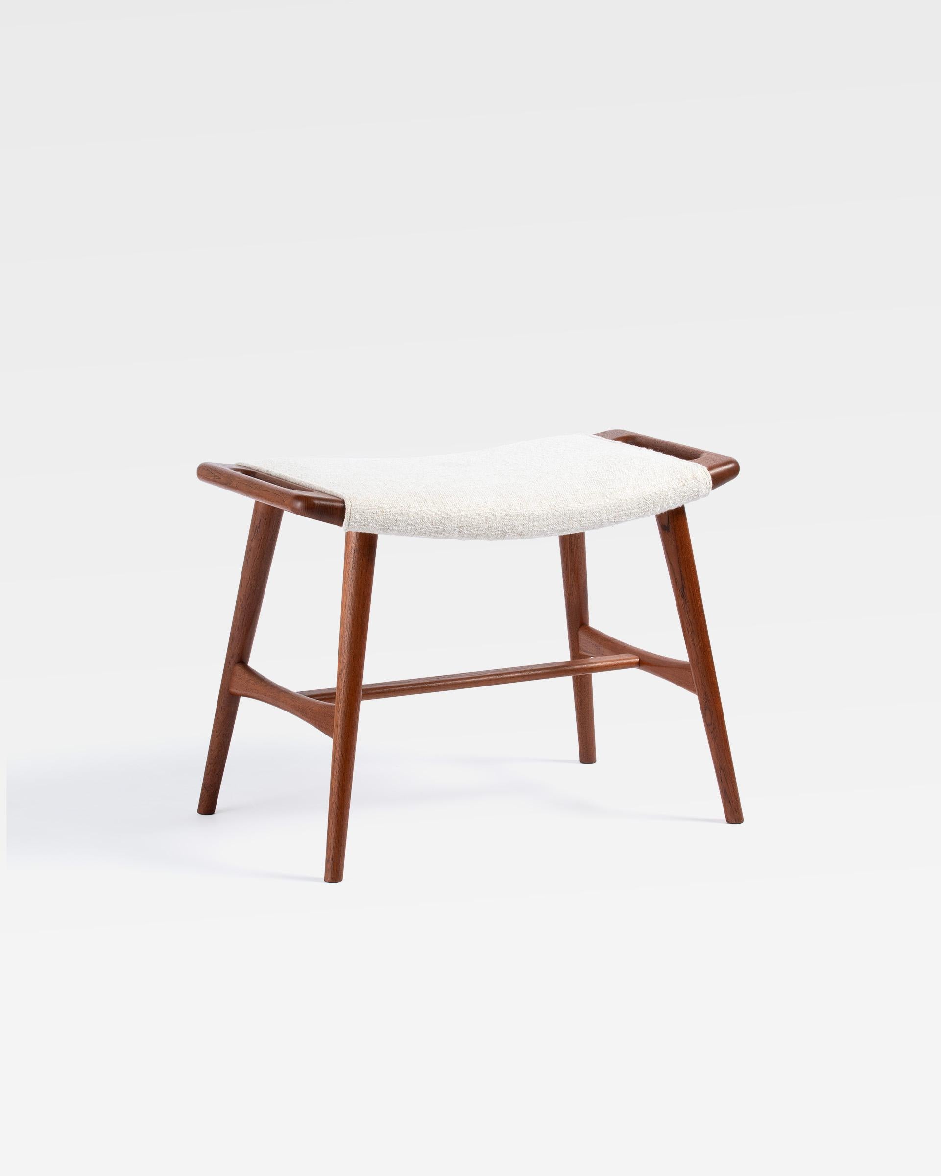 Hans J. Wegner - AP-30 Piano Stool 

Produced by A.P. Stolen in Denmark, this model is based on the AP-29 Papa Bear ottoman. The rarely seen piano stool has additional stretchers and longer legs. This example has an oiled teak frame and has been
