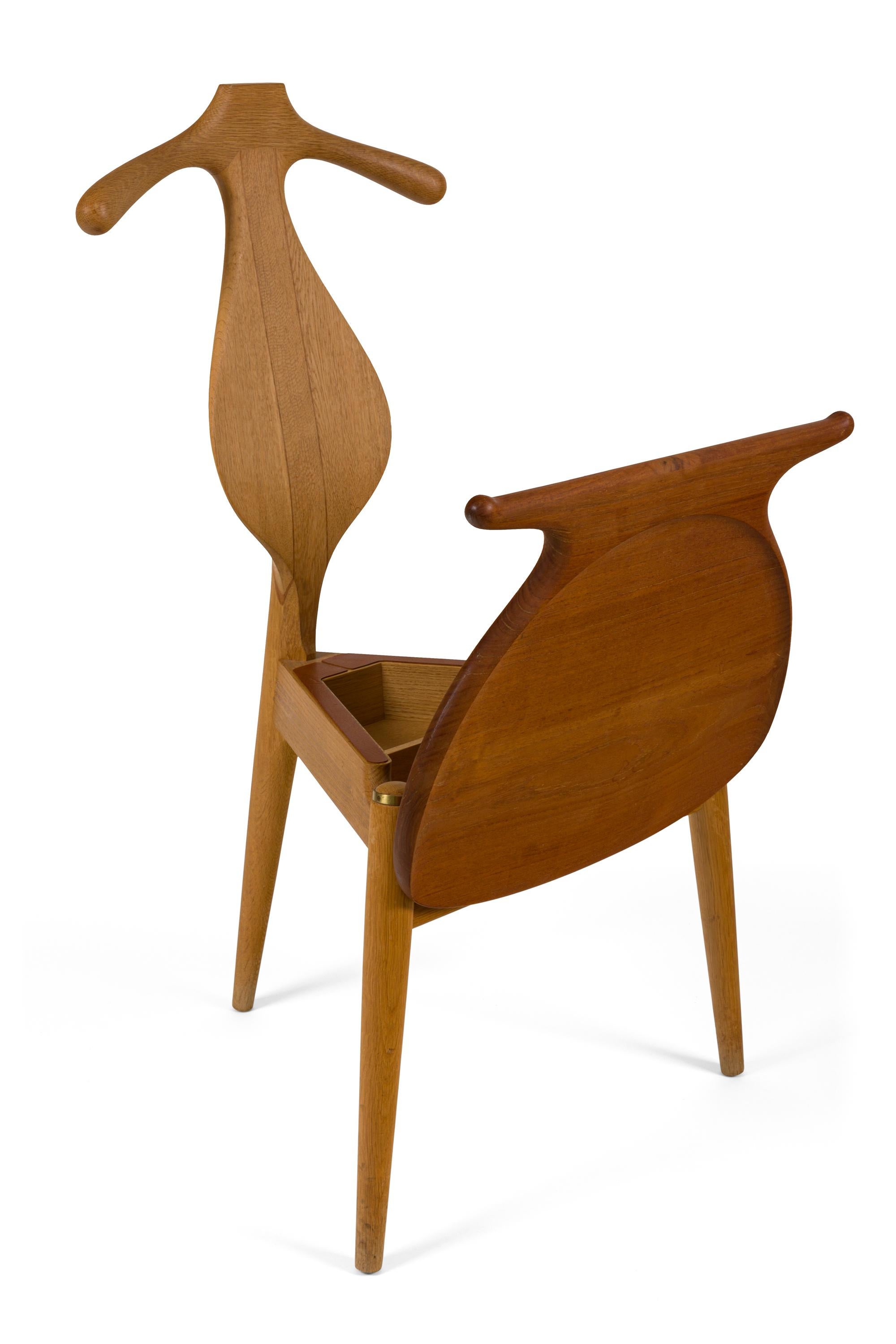 Wegner's iconic valet chair takes his abilities in design, scaling, proportion and craftsmanship to their limits. Expert carving and joinery highlight the idiosyncratic nature of the design, purposed as the ultimate gentleman's chair. The broad seat