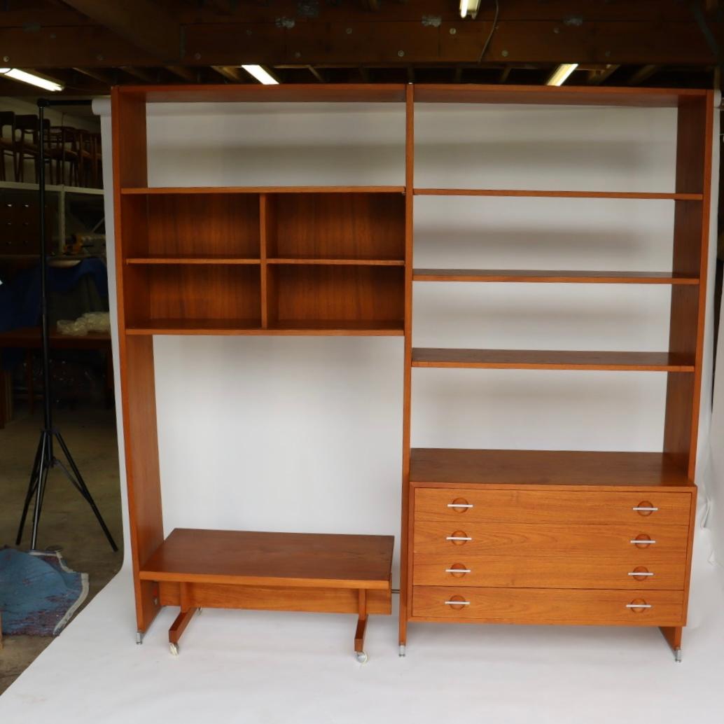 This is a vintage wall unit designed by Hans J. Wegner in teak with aluminum drawer pulls.

We have not restored this piece but it is in good vintage condition.

About the Designer:

Among Danish furniture designers, Hans J. Wegner (1914-2007) is
