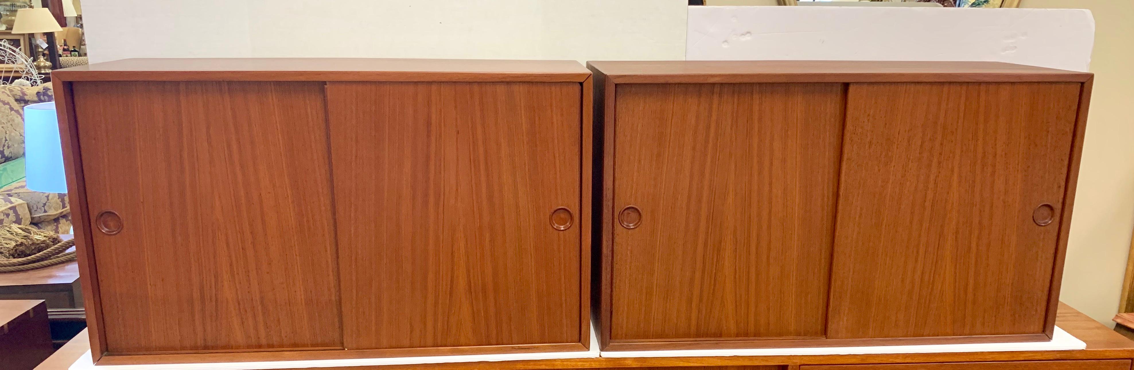 Mid century pair of Hans Wegner teak wall mounted sideboard cabinets. Ready to mount on your wall.
Iconic Scandinavian modern pair of matching sideboards for on great price. Ultra rare and coveted.
Features felt sliding drawers and other shelving -