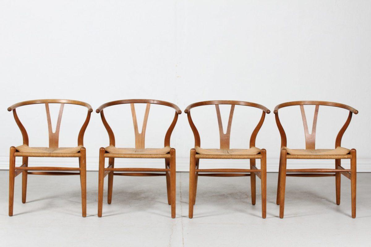 4 chairs model CH24 in an early version produced in 1973 and stamped by the cabinetmakers. They are in oak and Danish rope, with a warm and cool patina which makes them totally different from the still produced ones. This iconic model created in