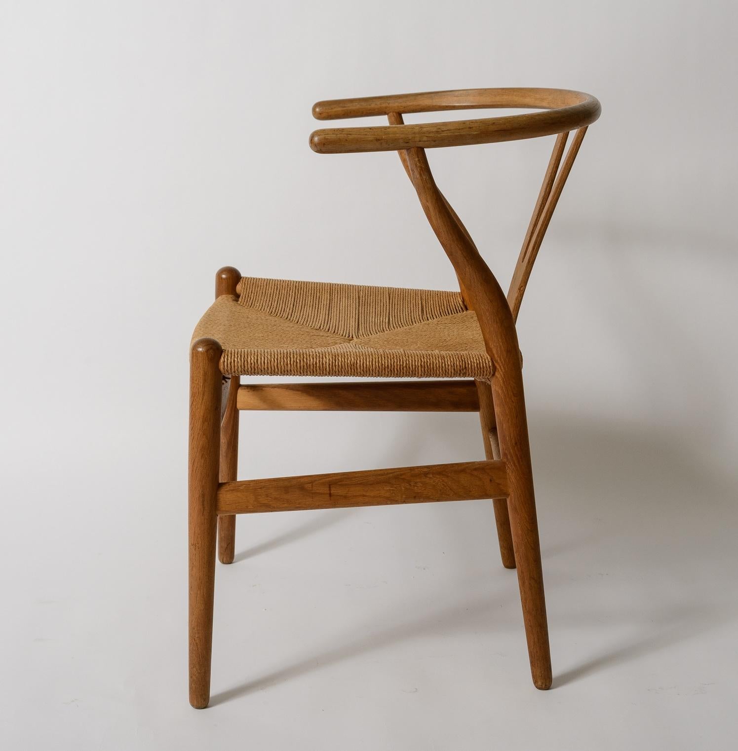 Hans Wegner Wishbone Chair
Executed in Oak
Original finish to Frame
Original Paper Cord Woven Seat
Manufactured by Carl Hansen and Son
Branded signature