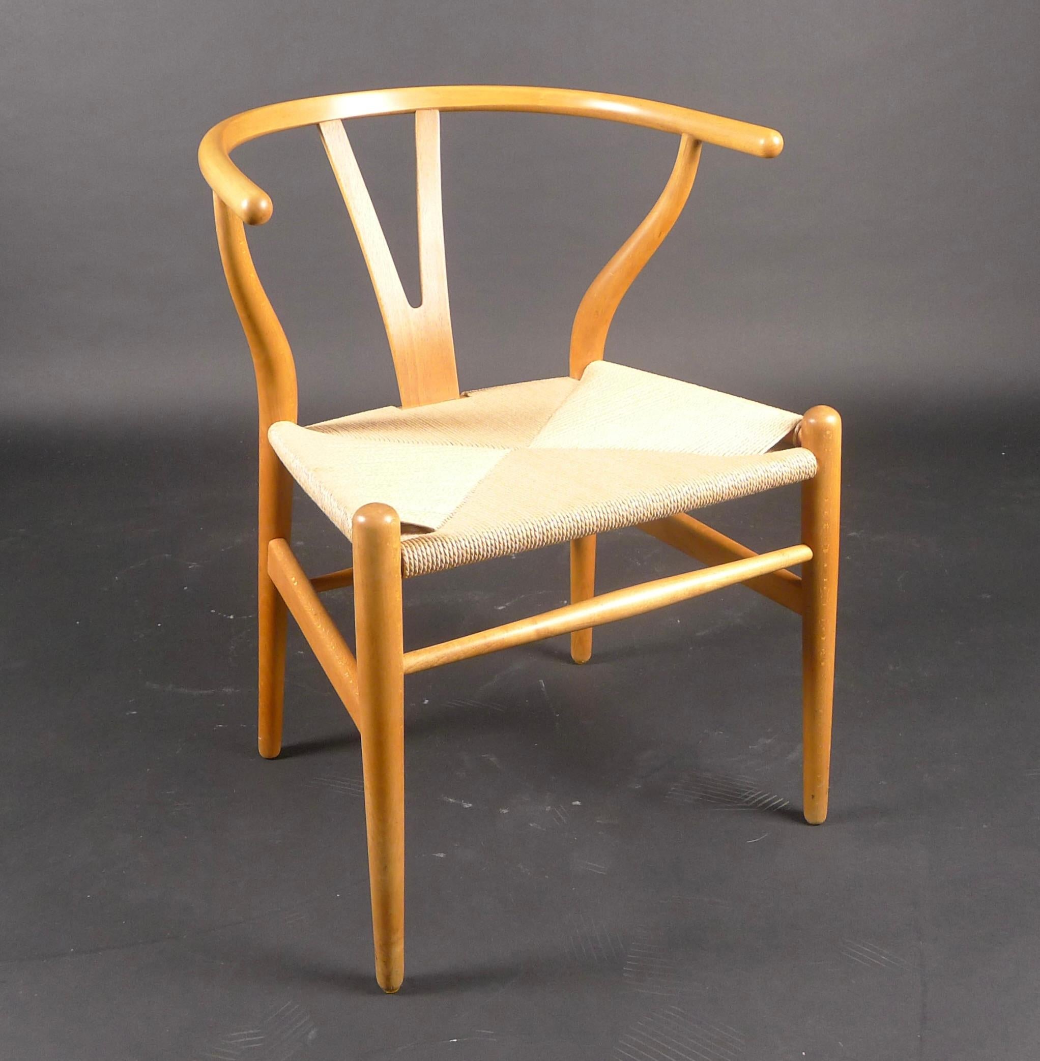 Hans J Wegner, Wishbone Chair, model CH24, made by Carl Hansen circa 1953 and retailed by Copenhagen department store Illums Bolighus (bears label)

Early example with beautifully crafted beech wood frame and paper cord seat, in excellent condition