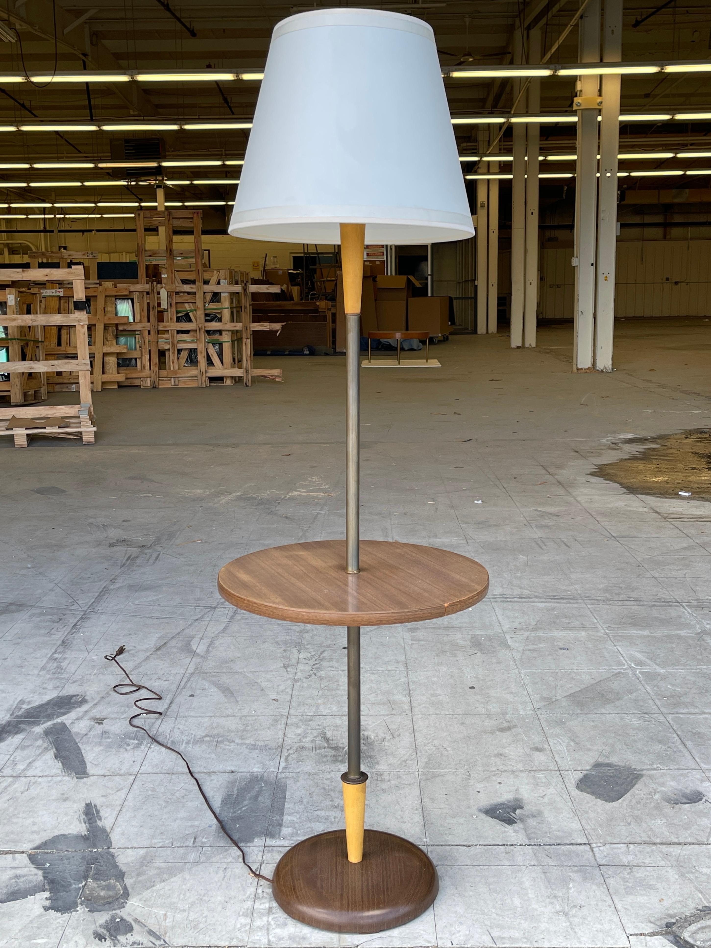 Custom floor lamp with floating round table on stem designed by Hans Weiss in 1960 for the master bedroom of a Riverside Drive apartment in New York City.
The lamp has a domed metal base which is faux screenprinted in walnut wood grain. Concealed