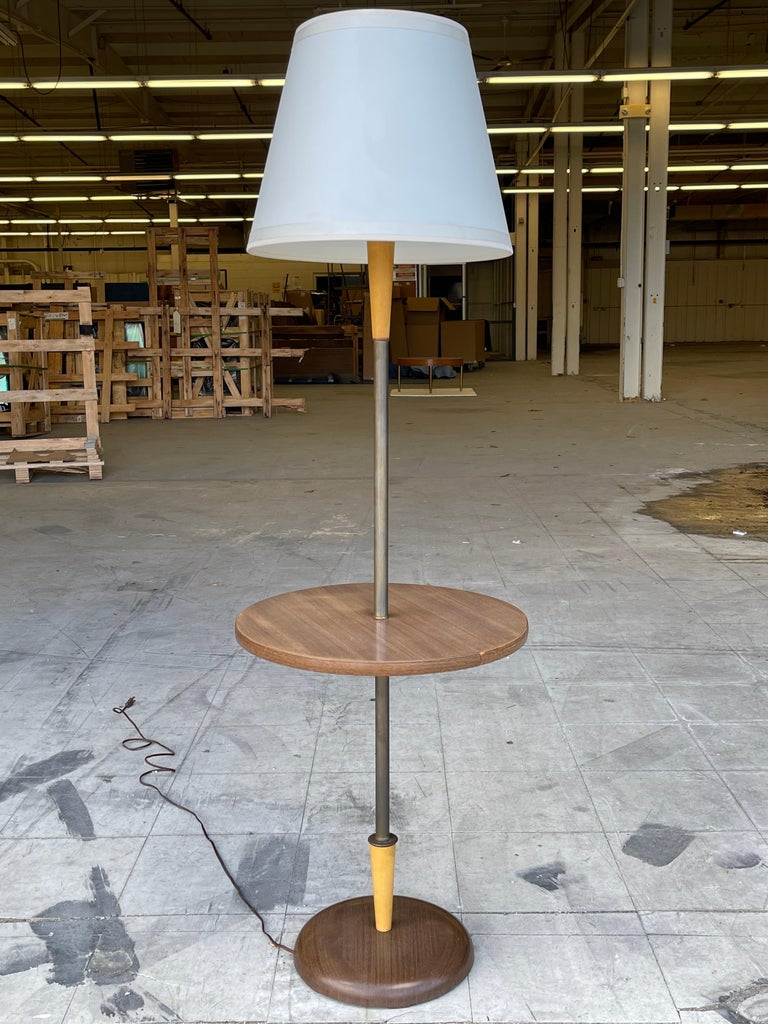 Custom floor lamp with floating round table on stem designed by Hans Weiss in 1960 for the master bedroom of a Riverside Drive apartment in New York City.
The lamp has a domed metal base which is faux screenprinted in walnut wood grain. Concealed