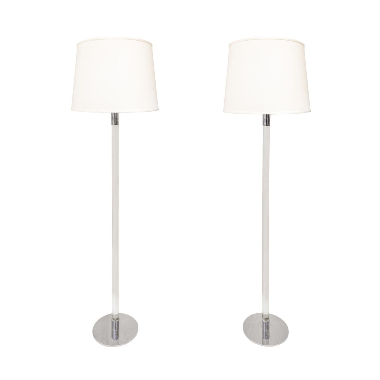 Pair of elegant floor lamps in chrome with glass rods, each with 3 bulbs, by Hansen Lighting, American 1960s (Signed on bases “Hansen Lamps Inc. N.Y.”) The cords are embedded in the glass so when the cords are faced to the side of the lamp they