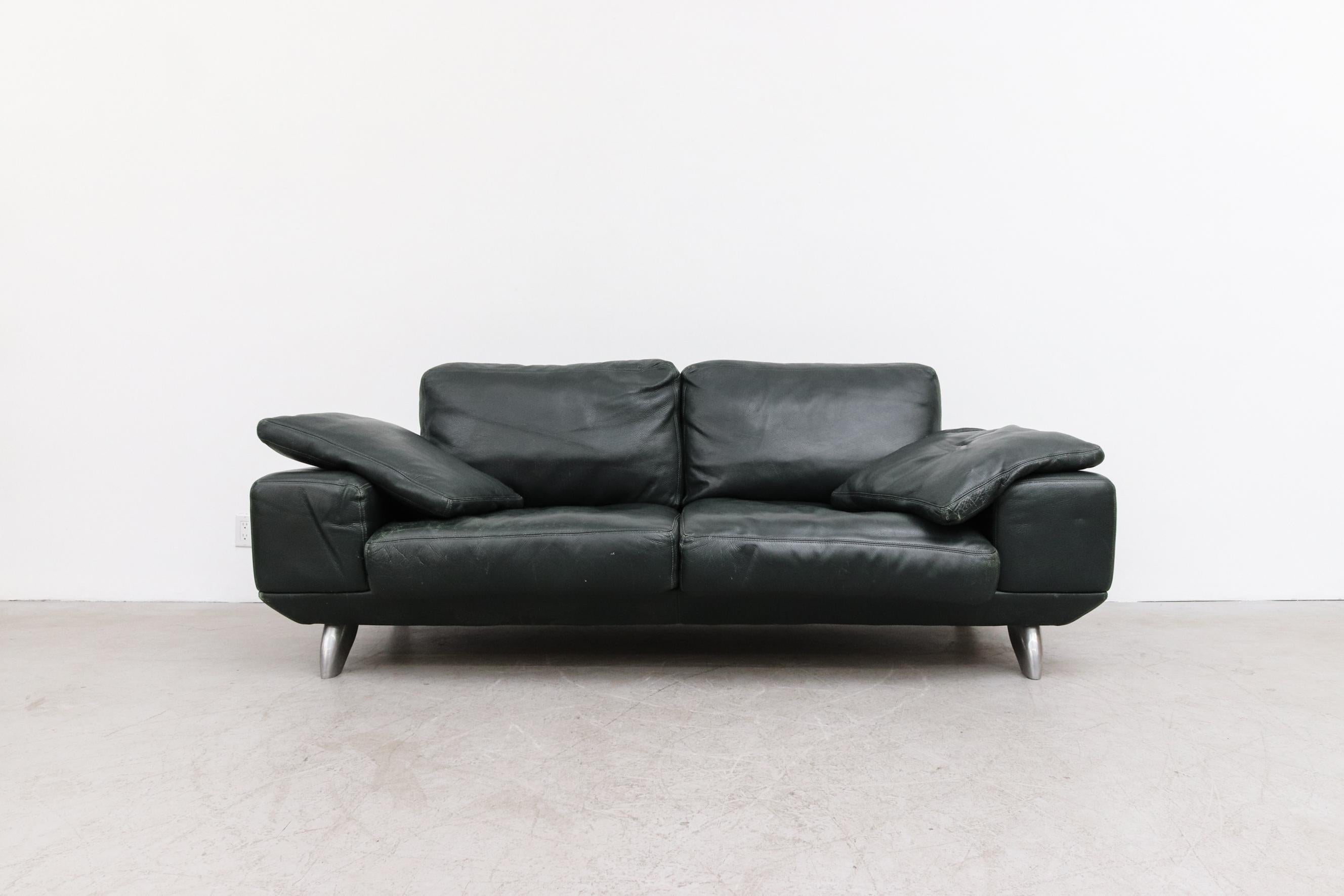 1980's MOD dark green leather sofa by Molinari. In good original condition with visible patina. Some indentations in the leather from transport that should relax over time. Has 2 matching pillows and very 80's brushed chrome feet. Wear is consistent