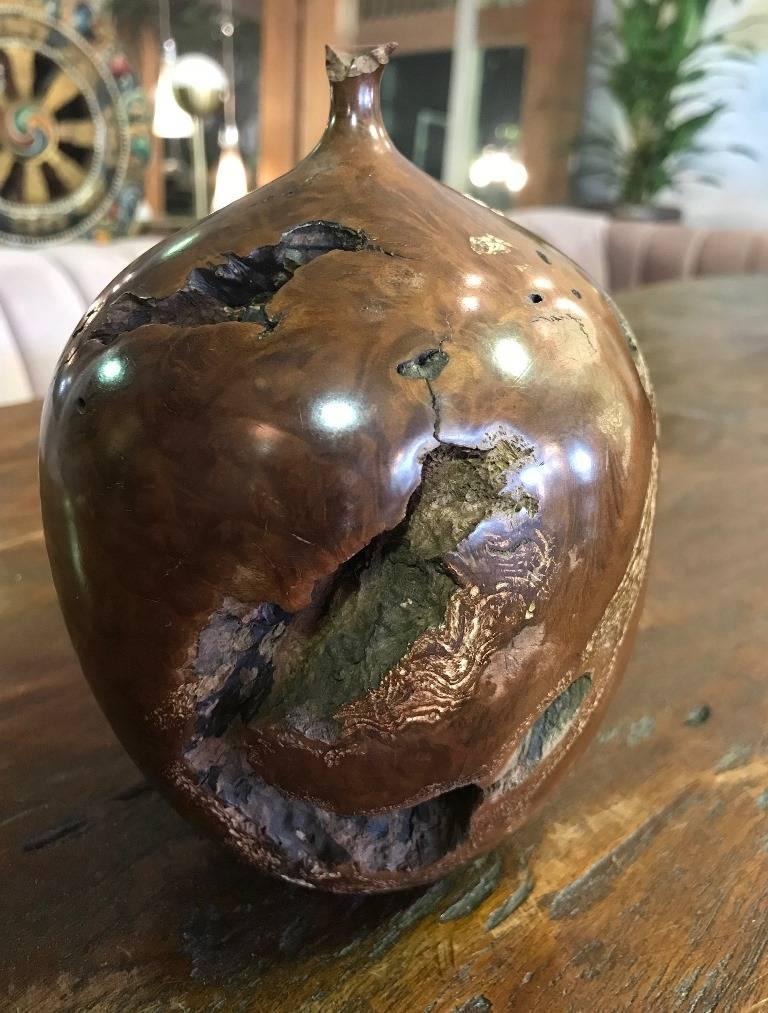 A very attractive piece by master wood sculptor/artist Hap Sakwa, widely considered a leader of the wood turning movement in the late 1970s and early 1980s. This piece is made of burled manzanita wood and is quite detailed, solid and eye