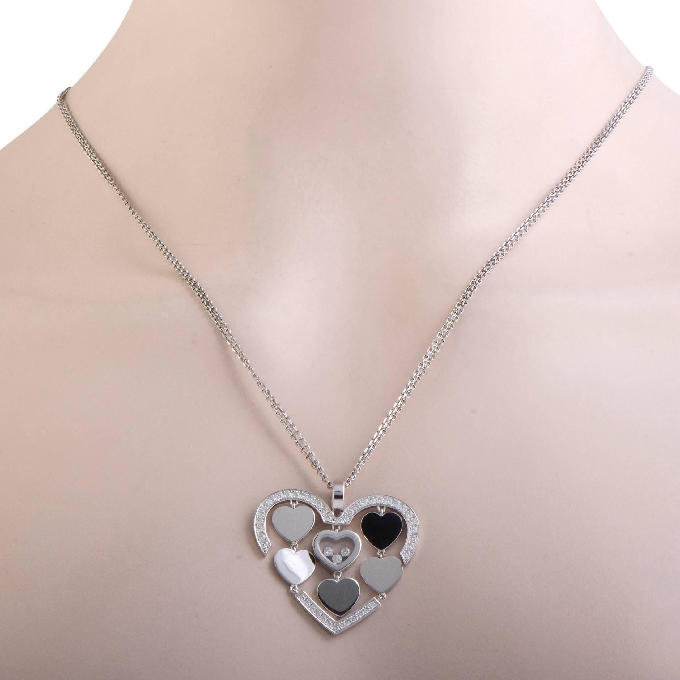 When you see this chic necklace from Chopard, the first thing that catches the eye is its breathtakingly beautiful diamond-set pendant. The heart-shaped pendant has five small hearts in it, one of which has a floating 'happy diamond', and is worn
