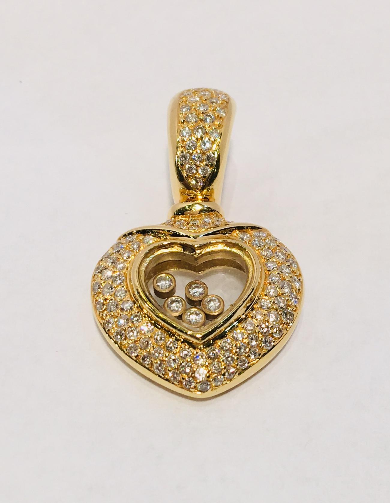 Heart-shaped, 18 karat yellow gold, diamond pave enhancer pendant features 5 bezel set round brilliant diamonds, encased in clear crystal, which float freely within the hearts.  5 diamonds measure 1.8 mm and weigh approximately .125 carats.  111