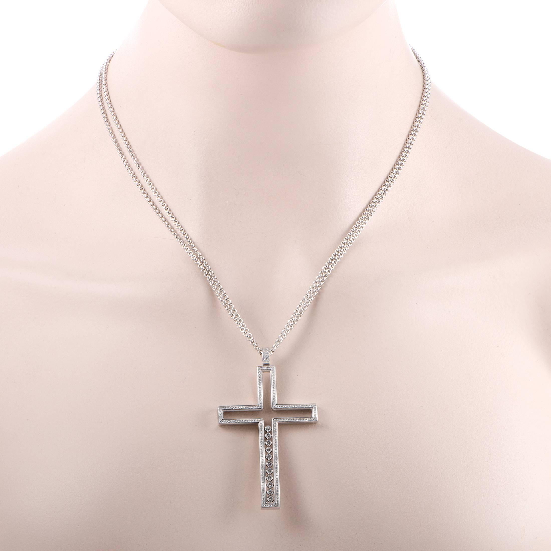 Magnificence and grace are personified in this breathtaking 1.13ct diamond paved cross-shaped pendant necklace by Chopard. The pendant boasts 11 floating diamonds from the center of the cross add to the finesse and elegance of the 18K white gold